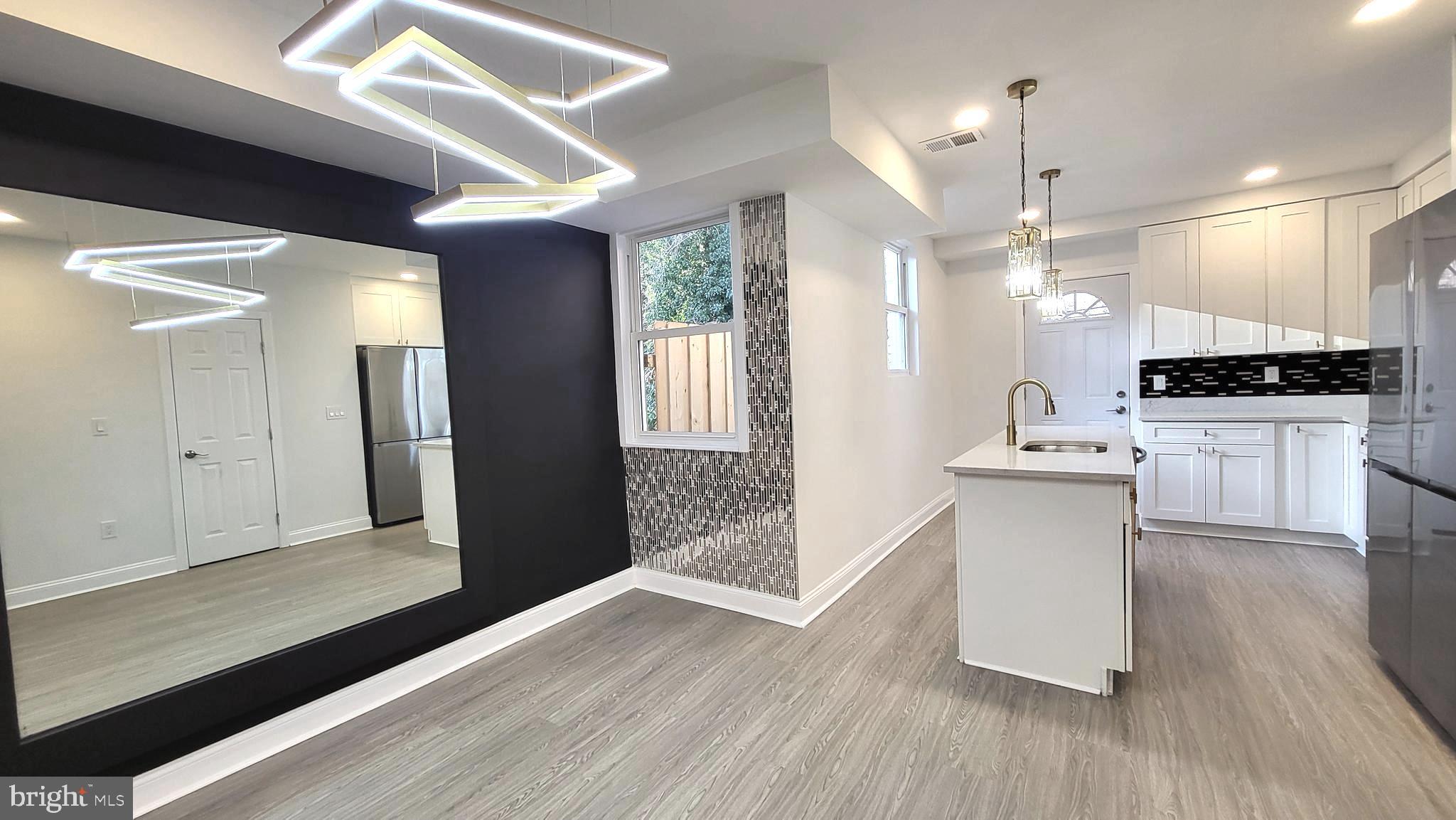 Gorgeous semi-detached home featuring exquisite modern customization's and a spacious open-concept layout perfect for entertaining and everyday living. This beautifully renovated property offers 4 bedrooms and 3.5 bathrooms, including a stunning primary suite and spa-inspired bathrooms designed for comfort and style.

Enjoy a fully finished lower level with an open entertainment space & additional separated room & bathroom that walks out to your private deck overlooking a fully fenced backyard—ideal for relaxing, hosting, or pets.

Located in the desirable Forest Park neighborhood, this home truly has it all! 
Furniture pictures are virtually staged but the gorgeous home designs are real!