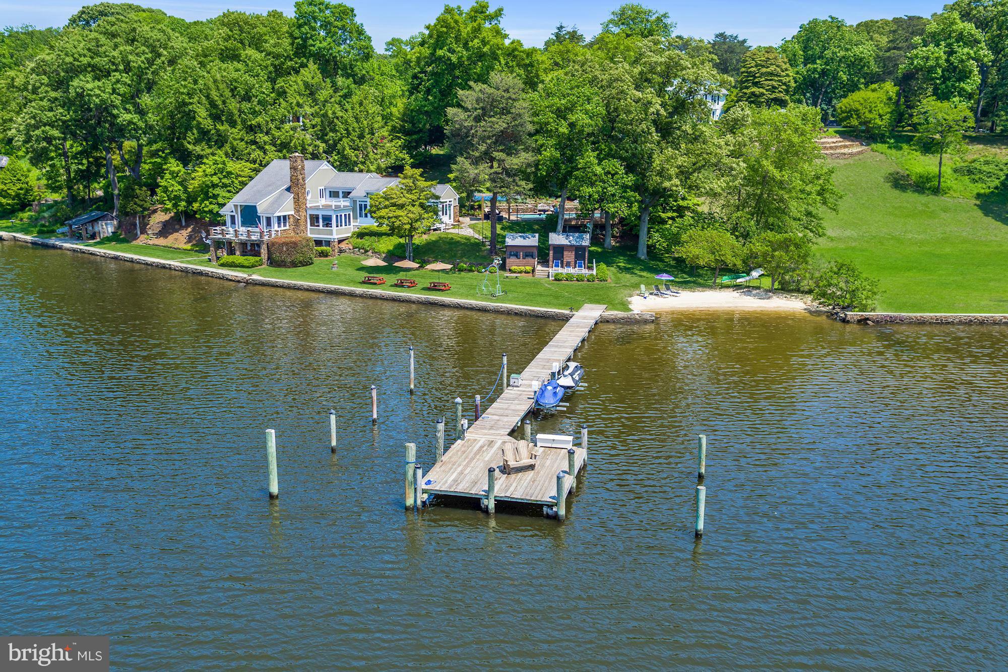 Historic Waterfront! Built in 1925 and was part of the estate of Balto. ice cream maker M. Hendler. Tucked away just beyond Harlequin, in the heart of Severna Park, this unique home offers tranquil waterfront living w/1.89 acres, private sandy beach, pier w/2 DW slips & 2 jet ski lifts, 3 beautiful gardens, pool, bath house & outdoor kitchen. Expansive water views & perfect for entertaining!