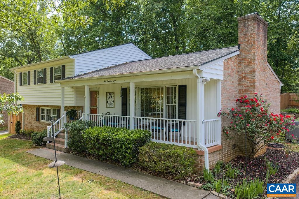 This lovingly maintained, split level home is nestled on an elevated lot in the leafy community of Woodbrook and is just a short walk to the elementary school. The main level features gleaming oak floors, a living room with wood-burning fireplace, a dining room, and a light and bright kitchen which was recently renovated. The upper level includes a spacious primary suite with private bathroom, two additional bedrooms, and another full bathroom. The basement is made up of a large and cozy family room, fourth bedroom, full bathroom, laundry, and a stunning sunroom with walkouts to a private patio and backyard. Spacious two-car garage. All three bathrooms were just completely renovated. Many systems updated (list available). No HOA. Private, low-maintenance backyard. 5 min to shopping and restaurants. 10 min to the airport, UVA, NGIC, and the Downtown Mall.,Quartz Counter,Fireplace in Living Room