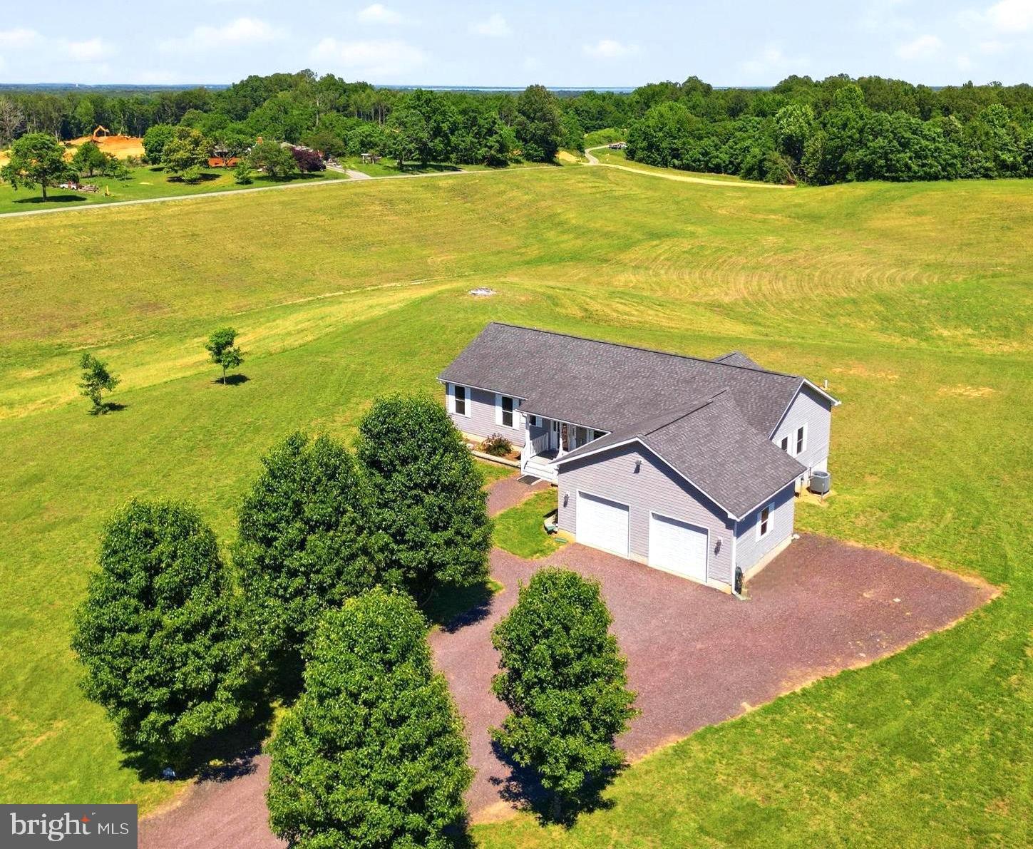 A Custom-Built Energy-Efficient Haven in Virginia’s Historic Northern Neck!

Welcome to 16111 Trigger Lane, an extraordinary custom-built estate that perfectly blends modern luxury, exceptional craftsmanship, and unparalleled energy efficiency. Situated on a sprawling 6.5-acre property—which includes a fully buildable 2.39-acre subdivided lot—this home offers an abundance of space, privacy, and long-term investment potential. Whether you are seeking a peaceful retreat from city traffic, a multi-generational estate, or a car enthusiast’s paradise, this property is designed to exceed every expectations.

The Gourmet Kitchen
The heart of the home is a chef’s dream, meticulously designed to be both highly functional and visually stunning. It is equipped with:
Luxury Custom Cabinetry offering exceptional storage space.
Premium Granite Island and high-grade stainless steel appliances.
Elegant Details including recessed lighting, Pergo flooring, a chair rail, and a massive walk-in pantry.

The Living Room & Master Suite Elegant Main-Level Living
The main level of this custom home is designed with an open, airy flow, featuring vaulted ceilings and high-end finishes that create an immediate sense of warmth and sophistication.
Luxury Custom Cabinetry offering exceptional storage space.

Adjoining the kitchen is the expansive living room, centered around a cozy gas fireplace and framed by soaring vaulted ceilings.  The main level house has 3 spacious bedrooms, including the luxurious Master Suite. This private sanctuary features:
Two Super-Sized Walk-In Closets providing unmatched wardrobe storage.
A Spa-Like Master Bath complete with high-end fixtures and a deep jetted tub.
A Convenient Main-Level Laundry Room with extensive extra storage space. 

In the fully finished basement there is a 4th bedroom which is set up  with private living quarters and  is sectioned off with its own foyer, full sized bathroom and bedroom all as one unit.  The basement has LVP flooring, recessed lighting, columns, sheetrock and an open floor plan concept!  You could make the perfect theatre area , game room and home office!  

Built to last generations, the seamless poured concrete walls provide near absolute protection against elements and pests while naturally regulating indoor temperatures for year-round energy savings! 
Just in case you want to add a second kitchen, the plumbing is already in place just behind the sheetrock!

Calling all car enthusiasts: the oversized 2 car garage features soaring ceilings with room for a vehicle lift.  Thanks to premium, energy-efficient upgrages-including a Trane air handler, spray foam, R-59 home insulation, and R-49 garage insulation-your utilty bills will remain incredibly low. 

Looking for that pool you have always wanted, well there is plenty of room here to add one!

History buffs will love this area! George Washington's birthplace is only 8.3 miles away and has a large sandy beach and picnic area!   Robert E. Lee's Plantation Stratford Hall is 13 miles away. It is an 1800 acre estate situated on the Potomac River.  

In the Northern Neck you will find a slower paced lifestyle where beaches, boating, fishing, wineries, fossil hunting, crabbing and time spent out on the water watching gorgeous sunrises and sunsets, seeing dolphins playing  are favorite things to do.! 

 Say good bye to city traffic and start enjoying life!  It all starts right here!  There are various state parks as well!  Westmoreland State Park is one of the closer ones and is 1321 acres!  It offers many different recreational activities and has its own beach(es).  16111 Trigger Lane King George is super convenient to Fredericksburg, Dahlgren Naval Base and is only 75 miles from Alexandria, VA.  Schedule your showing while this home is still available, with upcoming open houses being scheduled it is sure to sell quickly!
