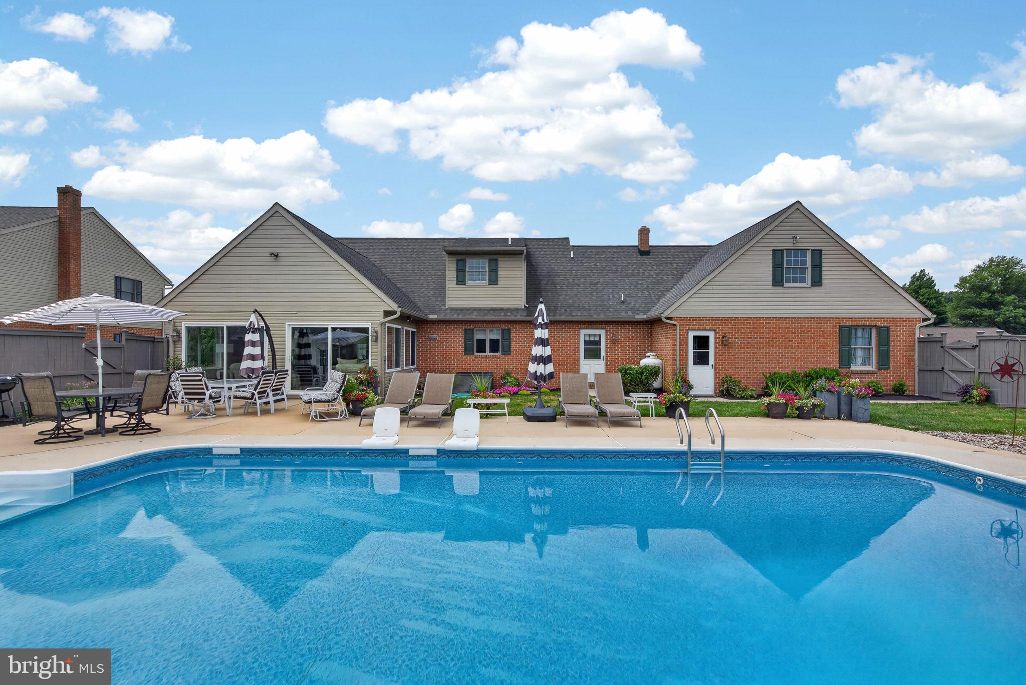Nestled in the heart of highly sought-after town of Lititz, this stunning all-brick Cape Cod offers the perfect blend of comfort, thoughtful updates, and exceptional indoor-outdoor living. Designed with the convenience of one-floor living, the home features a spacious first-floor primary suite complete with a soaking tub, walk-in shower, double-bowl sink, updated vanity with abundant storage, and a generous walk-in closet. The light-filled kitchen opens seamlessly to the living room, creating an inviting space for everyday living and entertaining, while the dining room is accented by a cozy fireplace. Just beyond, the breathtaking four-seasons room with cathedral ceilings provides the ideal place to relax and enjoy views of the backyard retreat. Step outside to the large inground pool with a diving board and a fully fenced yard offering plenty of room for recreation, pets, and gatherings. Upstairs, you'll find two spacious bedrooms, a full bath, and a walk-in storage attic with endless potential for additional living space or storage. A desirable 3-car garage completes the home. Recent improvements include a new roof (2021), new front door (2022), new water heater (2025), new luxury vinyl plank flooring on the second floor (2026), and an updated primary bath vanity with enhanced storage (2026). This exceptional home offers comfort, convenience, and the lifestyle you've been dreaming of just minutes from downtown Lititz.