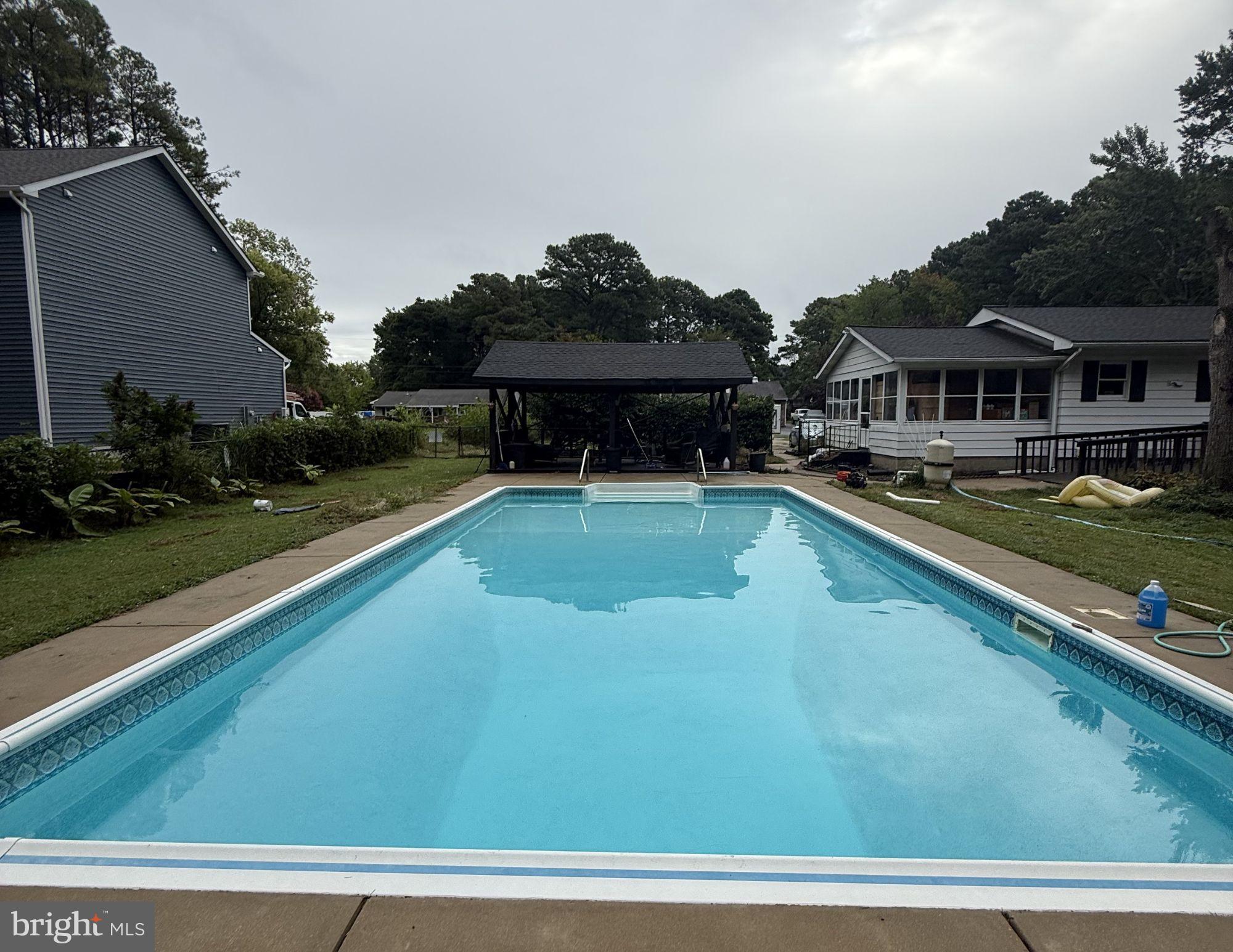 Back on the market with the POOL OPEN!  Welcome to 132 Pennick Drive in Stevensville, where easy one-level living meets the relaxed charm of a water-oriented community. This lovely rancher offers a thoughtful layout with two spacious bedrooms featuring their own ensuite bathrooms, plus a third bedroom and a full hallway bath, giving everyone their own space and comfort. Inside, you will find beautiful hardwood and luxury vinyl plank flooring throughout, creating a clean and cohesive look that is both stylish and low maintenance. The brand-new kitchen, completed in late 2025, shines with modern finishes and all new appliances, making it the perfect place to cook, gather, and entertain. Practical updates bring peace of mind, including a recently re-dug well with excellent water output. Step outside and enjoy your own private retreat. The in-ground pool is ideal for summer relaxation, while the double lot provides extra space, privacy, and possibilities. A rear ramp offers convenient accessibility, making this home comfortable for a variety of lifestyles.  Located in a water-oriented community, this property combines the tranquility of the Eastern Shore with the convenience of nearby amenities. If you have been looking for accessible, single-level living with modern updates, outdoor fun, and room to breathe, this Stevensville gem is ready to welcome you home.

This home is being sold STRICTLY AS-IS.  The seller has put a lot of money into renovations including all new kitchen appliances and cabinets in 2025, new washer and dryer in 2024, full bathroom remodel in 2023 and new 100ft well in 2022.  The pool is professionally maintained by Cal Pools in Stevensville.  All windows and cabinets in sunroom convey with property.