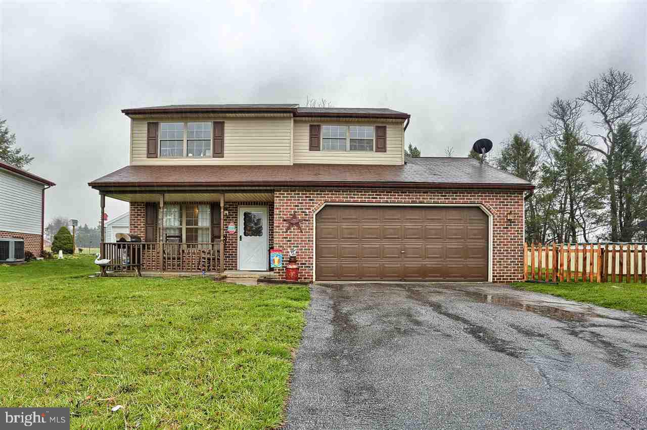 Don't miss this move in ready 3 bedroom, 2 full bath home in Locust Point with a 2 car garage,  a full bath on each floor as well as an updated heat pump and new flooring throughout 1st floor and 1st floor laundry. In addition, 1st floor laundry and a bonus room that leads to the fenced yard which backs up to farm land.