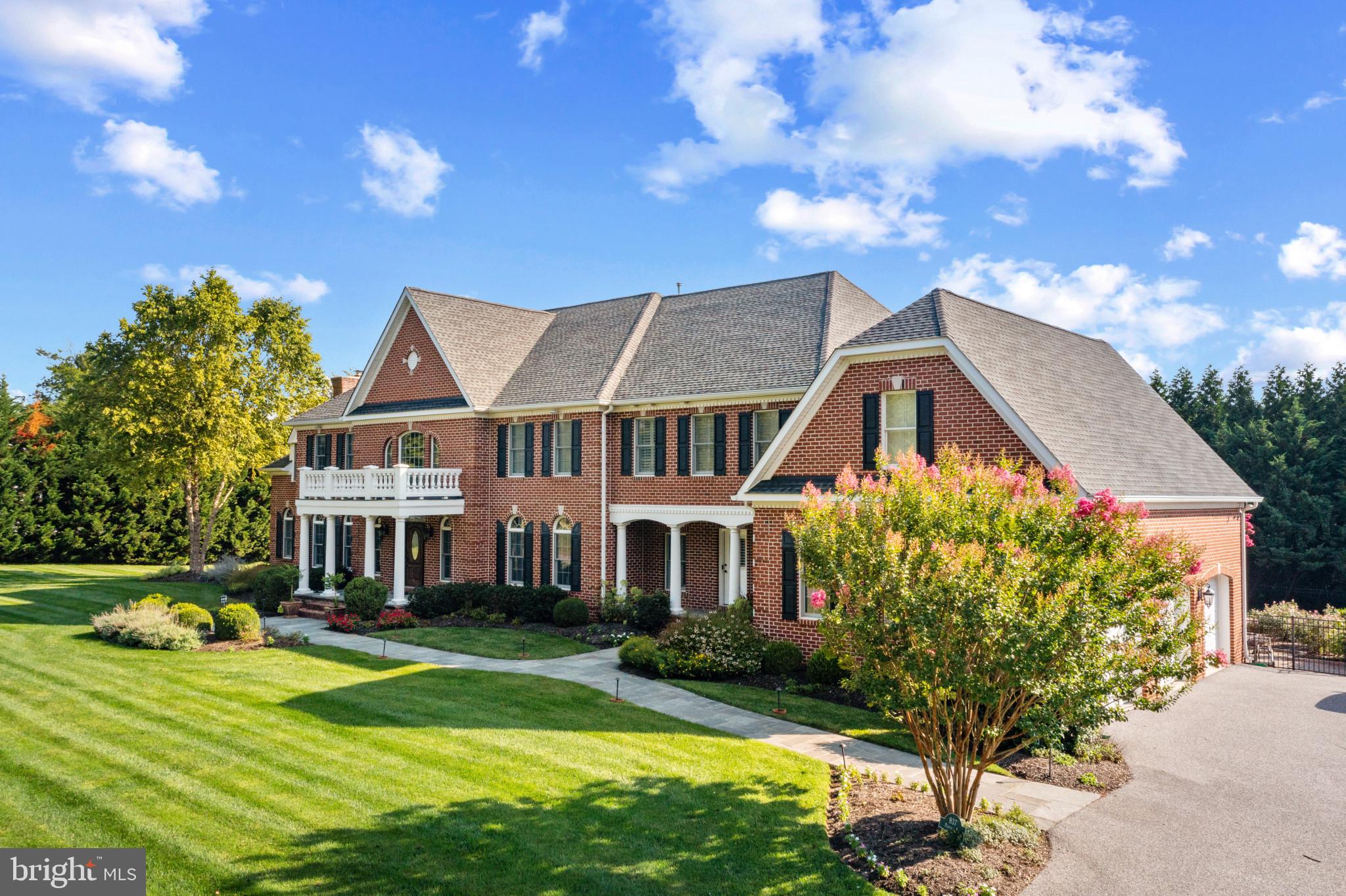 Exceptional Properties. Exceptional Clients. Tucked down a private drive on 1.88 acres, experience the perfect blend of charm and sophistication with this stunning, custom built, all brick colonial in a location that offers both privacy and convenience. As you enter into the elegant two-story foyer with dual curved staircases, you will be greeted by gleaming hardwood floors, high ceilings, beautiful moldings and trims, and an abundance of space at close to 8200 finished above grade square feet. This house is truly an entertainer's dream both inside and out. The main level floor plan includes oversized foyer, sitting room, dining room, living room with gas fireplace, study, media room with gas fireplace and full bar, breakfast room, kitchen, morning room, mudroom, laundry room and two half bathrooms.

Upstairs you'll find a luxurious primary suite including a dual-sided gas fireplace that warms both the bedroom and sitting room, a spa bathroom, two walk in closets with islands, high tray ceilings, coffee bar/beverage center and a second laundry room. Four additional bedrooms, two of which have designated  en-suite full bathrooms and two that share a Jack-and-Jill bathroom, will wow you with their size and gigantic closets.

Downstairs boasts 4000 additional square feet to include a bar/kitchen, large entertainment room with projector, pool table/foosball table, 6th bedroom with an en suite full bathroom and sitting room (perfect for in-laws or an au pair), exercise room, multiple storage rooms, a second full bathroom (on the side of the house closer to the pool) and walk up stairs out to your backyard oasis.

The remarkable outdoor space checks every box — a resort-like pool, gigantic stone patio with a full outdoor kitchen with large island and dining table for guests to sit down for dinner and mingling, brick fireplace with outdoor TV and lounge seating, fun playset on rubber mulch bed, and unlimited, level grassy spots to spread out onto for any and all outdoor recreational activities and games.

Additional highlights include the oversized 3 car-garage, surround sound, Lutron light system, generator, plantation shutters, professional landscaping, alarm system and more.

This is an incredible opportunity to own a spectacular property in a secluded enclave that is still just minutes from everything you want— schools, restaurants, coffee shops, grocery stores, 695/83, parks — at your fingertips.