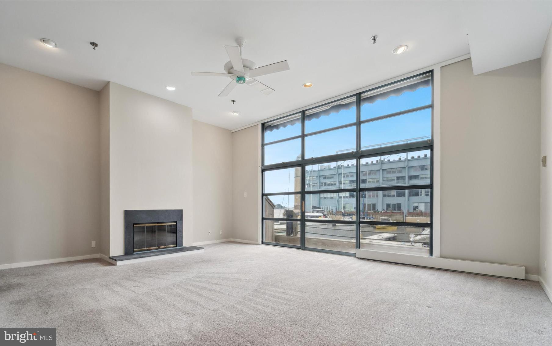 NEW PRICE, EXCELLENT OPPORTUNITY! PARKING AT YOUR DOOR! Welcome to Pier 5 — Waterfront Living in the Heart of Philadelphia.  Discover this spacious and light-filled two-bedroom, two-and-a-half-bath condominium at sought-after Pier 5 on the Delaware River in Penn’s Landing. This exceptional home offers a unique blend of tranquility and city excitement, featuring bright, open living spaces accented by a warm fireplace and timeless neutral tones throughout. Enjoy cooking and entertaining in the recently updated kitchen, thoughtfully designed with modern finishes and ample storage. Each of the two generous bedrooms offer new carpeting and include their own own en suite baths, providing privacy and comfort for residents and guests alike. Step outside onto your private deck overlooking the river and marina — the perfect spot to relax and take in the views.  Convenience is key, with your dedicated garage parking space located adjacent to your private lower-level entry. A utility area next to the garage makes loading and unloading groceries a breeze, and the convenient ground-level laundry room adds to the home’s effortless livability.  Residents at Pier 5 also benefit from impressive building-wide upgrades currently underway, including large-scale renovations to the interior common spaces of the Pier, and the re-creation and re-installation of the Pier’s iconic and stunning atrium garden. Once completed, this lush green oasis will offer residents a peaceful retreat just steps from their front door — a perfect complement to the waterfront setting. The seller will be paying the full cost of the assessment to pay for these building renovations, approximately $70K, at closing. In addition, the building features a beautifully maintained riverfront common terrace that spans the entire Delaware River side of the property — an ideal gathering place for morning coffee, sunset cocktails, or entertaining guests. This spectacular space offers sweeping views of the water and the iconic Benjamin Franklin Bridge, creating a one-of-a-kind backdrop for daily living.  Step outside your door and enjoy all that vibrant Penn’s Landing has to offer: riverside parks, seasonal events, waterfront trails, Spruce Street Harbor Park, Blue Cross RiverRink, and a wide variety of restaurants, cafes, and entertainment options. You’re just minutes from historic Old City, lively South Street, and the best of Philadelphia’s shopping, dining, and cultural attractions. Commuting is effortless with quick access to I-95, I-676, major bridges, and public transportation, connecting you seamlessly to Center City and beyond.  Please note that the interior common spaces of the Pier are currently undergoing significant renovation.  Images of the gardens were taken prior to the start of the renovations.  Don’t miss this opportunity to enjoy the best of waterfront living with the comfort, convenience, and excitement of city life at your doorstep.  Schedule your private tour today and experience Pier 5 for yourself!