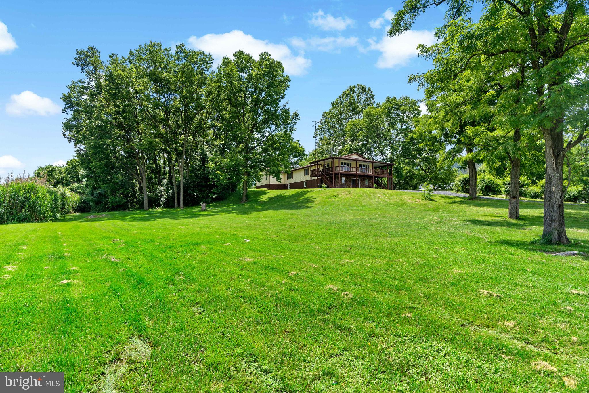 Charming Raised Ranch on 1.75 Scenic Acres – Just Minutes from Town!
Discover the perfect blend of country serenity and town convenience with this spacious 5-bedroom, 2.5-bath raised ranch nestled on 1.75 acres of pastoral beauty. Set in a peaceful rural setting on the outskirts of town, this home offers the privacy and tranquility of the countryside with easy access to local amenities.
Step inside to find an open and inviting layout featuring a generous living room and a beautifully updated kitchen with granite countertops—ideal for family meals and entertaining. A large family room provides plenty of space for gatherings, movie nights, or relaxing in comfort.
Enjoy sweeping views of the surrounding landscape from the expansive wrap-around deck—perfect for morning coffee, sunset dinners, or simply soaking in the peaceful surroundings.
This home also features a full basement for extra storage or future finishing, and a handicap-accessible ramp at the rear entrance for added accessibility.
Whether you're looking for room to grow, space to entertain, or a quiet country escape, this property delivers.

Highlights:

5 bedrooms | 2.5 bathrooms

1.75-acre lot with scenic, pastoral views

Handicap-accessible rear ramp

Spacious wrap-around deck

Granite kitchen countertops

Full basement

Just minutes from town

Don't miss your chance to own this rare gem in the countryside—schedule your showing today!