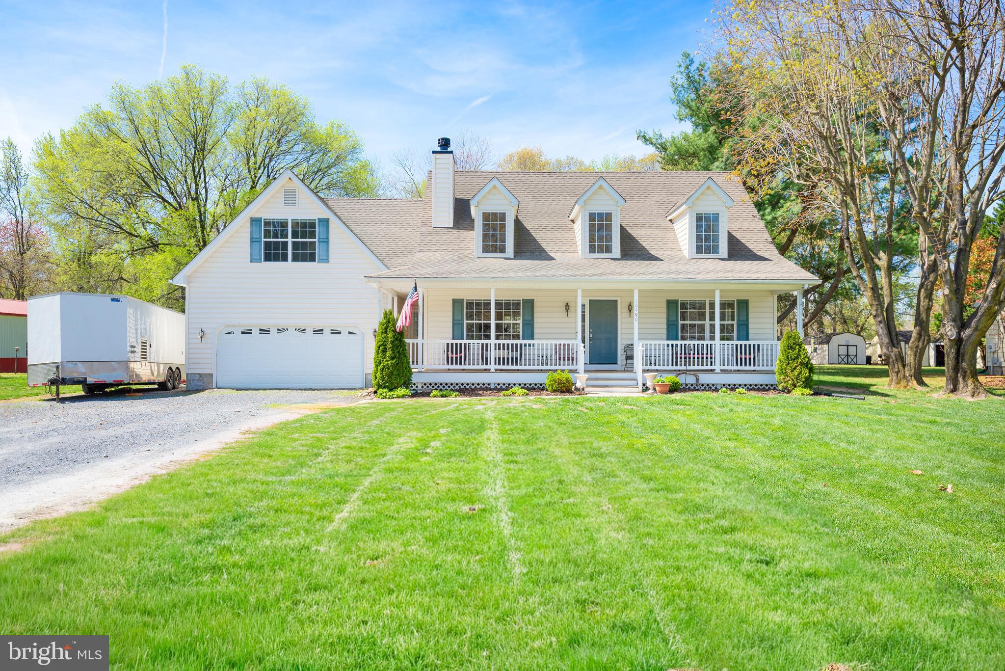Tucked away in a quiet country setting just minutes from downtown Easton and convenient access to Rt. 50, this well-maintained Cape Cod offers the perfect balance of privacy and accessibility. Set on a .63-acre lot backing to open space, the home features a bright and inviting main living area with wood flooring, a wood-burning fireplace, and soaring cathedral ceilings that create an open, airy feel. The layout flows easily into the dining area and kitchen, making it well-suited for both everyday living and entertaining.
Offering 4 bedrooms and 2.5 bathrooms, the home also includes a versatile bonus room.  Recent updates include a new rear deck, ideal for outdoor dining or relaxing while overlooking the peaceful backyard, as well as a new washer and dryer installed in 2024 and a vapor barrier added in the crawlspace for improved efficiency and maintenance. Additional features include a spacious 2-car garage and a functional layout that offers both comfort and flexibility. Backing to open space and surrounded by a quiet setting, this property delivers a more relaxed pace of living while still being just minutes from Easton’s shops, restaurants, and everyday conveniences.