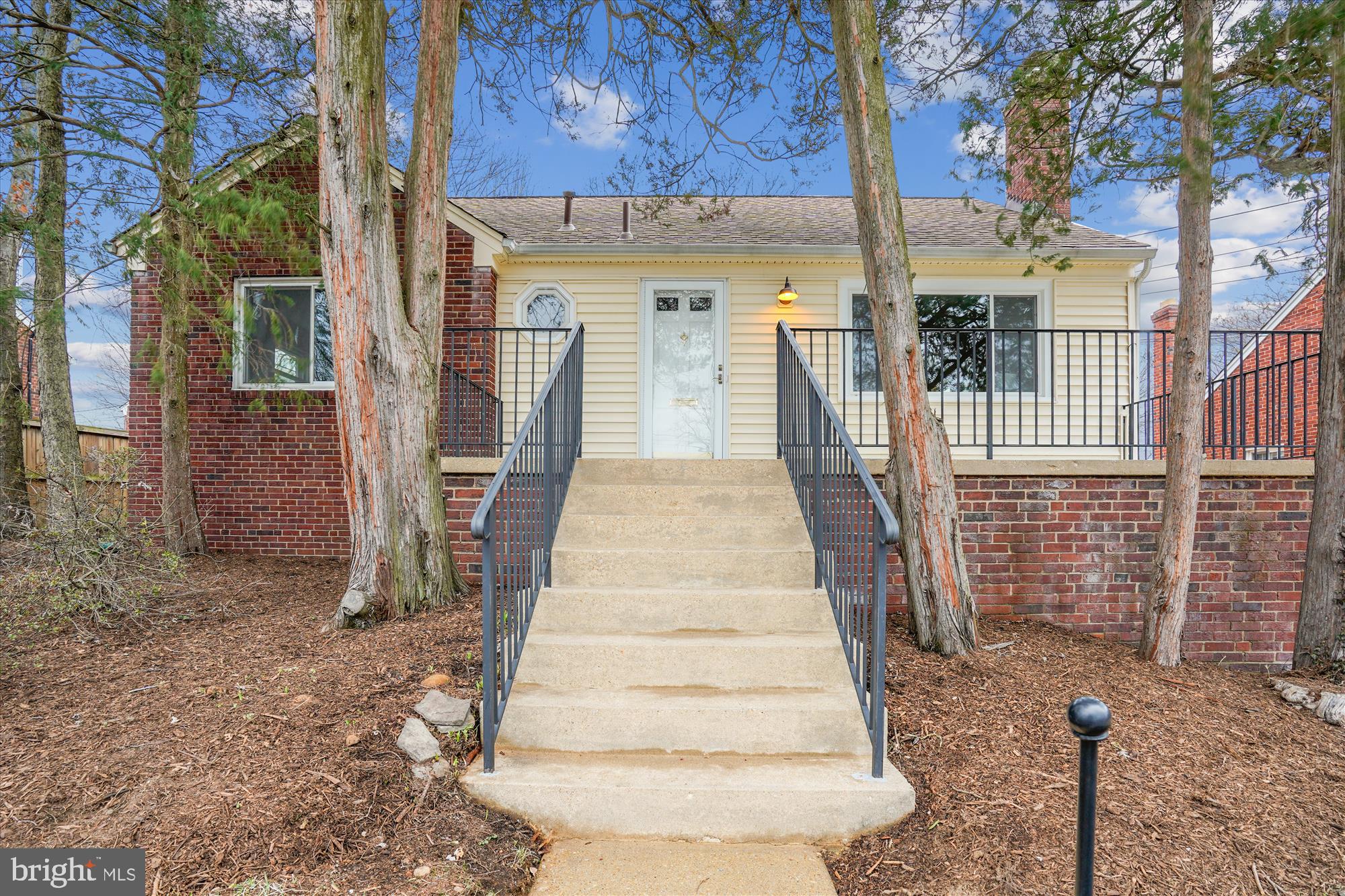 Come see this Charming  3 bedroom/1 bathroom Rambler with WALK-UP BASEMENT.  Located in the sought after neighborhood of DOMINION HILLS! This home is set up on a hill with amazing views out your front window- a wide view towards DC and Ballston! The owner has rebuilt the single detached garage with ample storage and there is still plenty of space on the driveway for several other cars.  As you enter the home, you will see the beautiful hardwood floors on the main level.  There is a cozy family room featuring a wood burning fireplace with an elegant mantel and loads of natural sunlight.  There is a separate dining space open to the kitchen and family room.  The kitchen was renovated to include new cabinets, custom countertops and stainless steel appliances.  The whole home has been freshly painted and lighting updated. The lower level has brand new carpet and a large recreation room - and lots of natural light! There is also large unfinished space for storage and a laundry room with a sink. Additional storage space in the partially floored attic!  Our contractor has estimated $15,000 to add a FULL SECOND BATHROOM to the basement (buyer to buy tile, vanity, toilet, faucet, lighting).  This home is turnkey and ready for the next owners!  IMPROVEMENTS INCLUDE: Paint (2025), Carpet (2025), Garage renovation/garage door (2024), Updated full bathroom (2025), New Outdoor Railings (2024),  Furnace (2014), Roof (2013), Kitchen Renovation (2013), Windows (2017/2013),  Washer (2018), Dryer (2016),  Refrigerator (2022), Attic Stairs (2018), New Electrical Panel (2013). NO HOA!  Enjoy the unbeatable location, just moments away from Westover and East Falls Church Metro, as well as Arlington county parks including Dominion Hills Park, Madison Manor Park, Westover Park, and the W&OD Trail. Award-winning schools: Cardinal Elementary, Swanson Middle, and Yorktown High School.