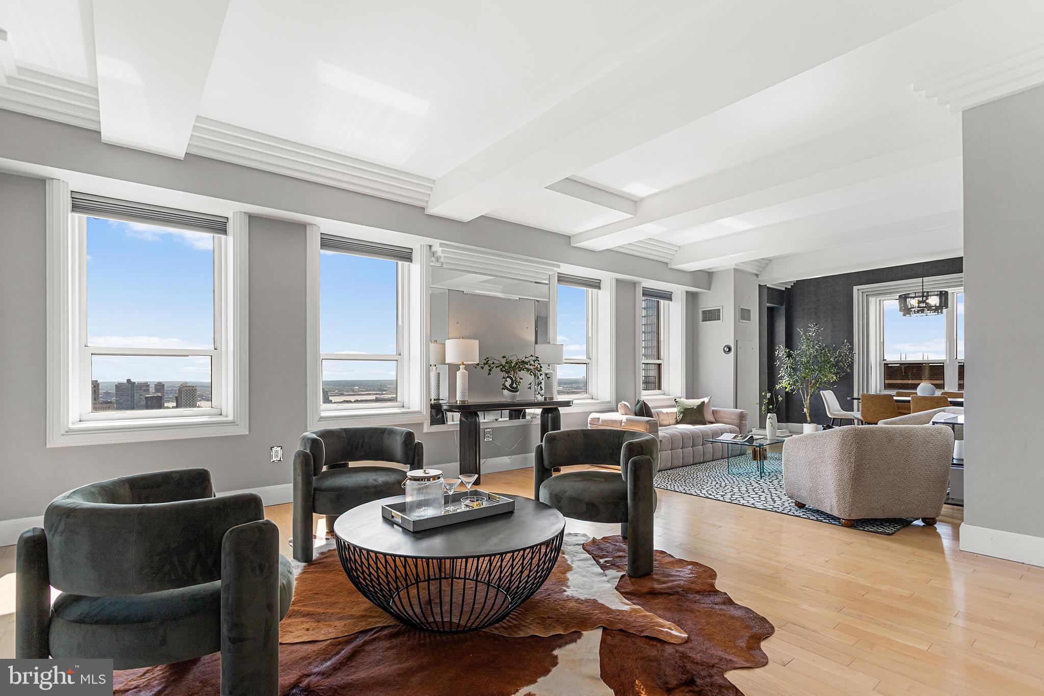 Unique opportunity to own a stunning Full Floor Penthouse residence in the Aria - one of the oldest Art Deco buildings in Philadelphia, designed by Edmund Gilchrist over a century ago. Full 360 views of the city from the 32nd floor overlooking many of the most iconic buildings in the Philadelphia skyline. The elevator opens directly into this stunning full floor residence - a rare luxury in the city. The custom solid walnut woodwork in the hallway is the first indication of the level of design upgrades made in this home. Enter the massive living area and be greeted with spectacular panoramic views of the City and the River. The hand carved Carrera marble fireplace imported from Portugal, new extensive crown molding, baseboards, custom framing and moldings around windows and solar paneled powered blinds are just a few of the incredible upgrades and details this luxury Penthouse offers. Enter the king sized suite through a double entry doorway and a hallway lined with incredible custom closets. Take in the beautiful views of the City Skyline, custom built deep storage unit, hidden closet, white Carrera marble windowsills, chandeliers, new lighting and a luxurious bathroom suite featuring a new vanity with double sink, white granite countertops, beautiful tile work, new lighting, walk-in shower and a separate soaking tub with amazing views! The large second bedroom located away from the main living areas offers privacy, an ensuite with Restoration Hardware vanity, lighting, hardware and tile work. This one of a kind home has a gourmet kitchen with Viking appliances, subway tile backsplash and granite countertops. The powder room features modern wallpaper, vanity, basin and hardware. Located in the heart of Philadelphia's premier entertainment and cultural district, The Aria is within walking distance to Suburban Station, City Hall and the Market-East subway & just a short walk to Rittenhouse Square. The Aria features 24-hour concierge services, on-site maintenance, pet spa, bike storage room, state of the art fitness center, business and media center, residents lounge with dining facilities and full catering kitchen, as well as a guest suite available for reservations. Schedule your showing today to own a piece of Philadelphia history!