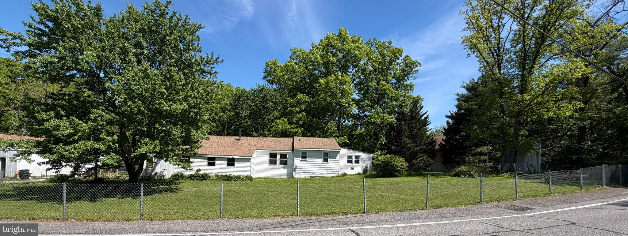 OVER 1 ACRE LOT IN HIGHLY DESIRED AREA  may be possible for Horses on this lot
Public water and septic.  main house plus in law suite, 
2 car garage