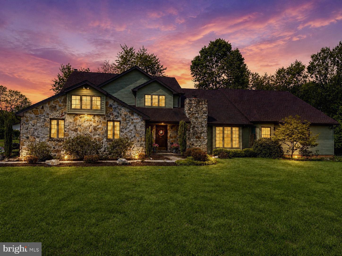 Welcome to this exceptional custom home situated on 2.33 acres of level, cleared land accented by mature trees, offering the perfect blend of privacy and an amazing neighborhood.   Home backs to beautiful farm land and some amazing views.  Featuring 4 spacious bedrooms and 3.5 baths, this beautifully crafted property showcases quality workmanship and thoughtful upgrades   

The exterior combines timeless stone with brand-new vinyl siding for striking curb appeal. Inside, a dramatic two-story foyer opens to an expansive living room highlighted by a stunning stone fireplace and second-story overlook. The updated kitchen features updated appliances, including a new stove &  dishwasher, along with a breakfast bar that flows seamlessly into the bright breakfast nook and inviting family room.

A luxurious main-level addition completed in 2024 includes a second primary suite with an elegant bath featuring premium Brizo fixtures, custom vanities, quartz countertops, and a spa-inspired shower. The suite also offers a cozy sitting area centered around a spectacular 60-inch see-through fireplace.  The Primary Suite includes a Vault Room that every gun enthusiast would love to have.

A spacious mudroom with laundry creates the ideal drop zone for everyday convenience. Upstairs, you’ll find three generously sized bedrooms, including an impressive primary suite with tray ceilings, French doors, and a beautifully appointed en suite bath featuring a dressing vanity, jetted soaking tub, walk-in shower, and oversized walk-in closet with built-ins. All new luxury commercial grade LVP flooring and part of the main house.

Enjoy peaceful outdoor living on the screened-in porch or the expansive deck, overlooking the serene property. In addition to the attached two-car garage, the detached three-car garage provides endless possibilities for a workshop, storage, or hobby space.  New gutters and downspouts are two years old.

Roof is eleven years old and two years old on the addition,   updated HVAC systems, new blown-in attic insulation, and upgraded electrical service with a new 400-amp main breaker and two new 200-amp breakers, offering both efficiency and peace of mind.

This one-of-a-kind property combines space, luxury, and modern updates in a beautiful setting.