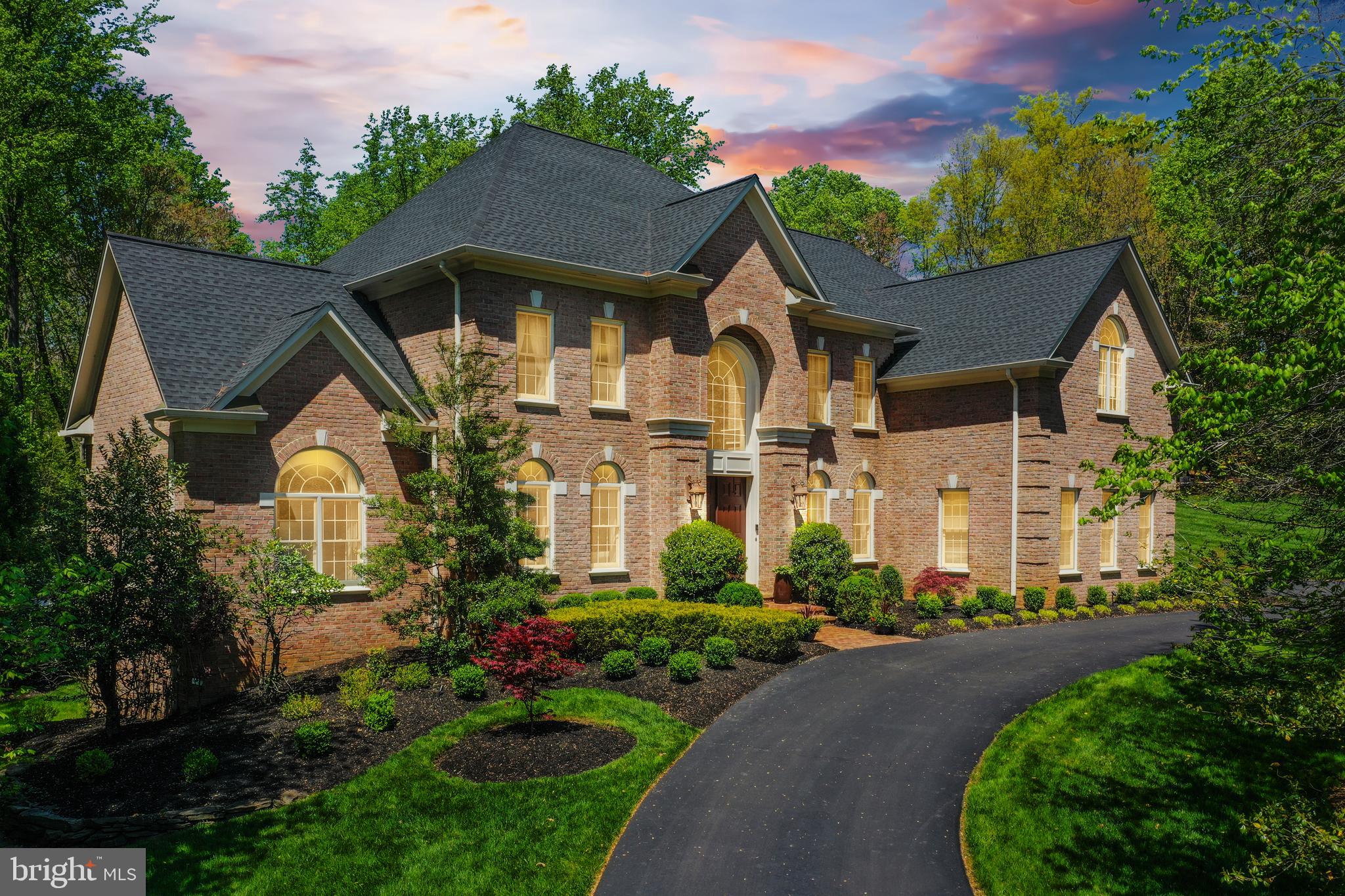 Introducing a masterpiece of elegance and craftsmanship, this exquisite residence embodies luxury living at its finest. Nestled on a sprawling 2.66-acre lot in a prime location, this meticulously designed home offers a sanctuary of sophistication and style.
Boasting a well-built structure and impeccable attention to detail, every corner of this property exudes quality and charm. From the moment you arrive via the grand circular driveway, you are greeted by the grandeur of this exceptional estate.
The expansive lot size of 2.66 acres provides ample space for outdoor enjoyment and endless possibilities for landscaping and recreation. Whether you seek tranquility in the beautifully landscaped grounds or entertain guests in the spacious outdoor areas, this property offers the perfect balance of serenity and sophistication.
Luxurious living spaces, high-end finishes, and panoramic views further enhance the allure of this remarkable home. Experience the epitome of luxury living in this distinguished residence that harmoniously blends timeless elegance with modern convenience.
This all-brick home showcases three levels of living-space with 6 bedrooms 4 1/2 bathrooms, hardwood floors and crown molding throughout, a grand two story ceiling foyer, curved stairways with twist and basket wrought iron baluster, powder room, coat closet, spectacular great room with two story Palladian windows and motorized blinds and gas fireplace. Living room with gas fireplace and motorized window blinds, Dining room also with motorized window blinds, Butler’s pantry with a brand new 1 week old wine cooler. Study/Office with french doors and large windows. Home theater/Media room with a state of the art surround sound system. Speakers throughout the house. Amazing gourmet kitchen with white macauba stone counters, oversized stainless steel sink, instant hot water dispenser, oversized island also with sink and garbage disposal, all high end appliances, Sub Zero refrigerator, Wolf 6 burners gas stove and a wall mounted pot filler, Wolf ventilation hood, Wolf plate warmer, Jen-Air microwave and wall oven, Jen-Air trash compactor, Bosch dishwasher. Second stairways connecting to upper level. Walk in pantry. Breakfast room with built in and sliding glass doors to deck. Sunroom with gas fireplace. Laundry room with built in cabinets, utility closet and Bosch front load washer and dryer. 
The upper level boasts 4 en-suite bedrooms. The primary suite features large his and hers walk-in closets, each one with its own digital safe and a breathtaking primary bathroom, with skylights, dual vanities, soaking tub, heated floor and a spa dual shower, towel warmer, bidet, fridge and tv.
The bright lower walkout level is fully finished, with french doors and large windows, 2 additional bedrooms, a full bath, a huge recreation room, a gym and lots of storage.
The Trex deck has a Wolf stainless steel gas barbecue grill connected to the gas main line.
The enormous patio with the pergola and the brand new one year old 18’ swimming hot tub and spa, is great for entertaining. Garden lighting.
Oversized side load and heated 3 car garage with epoxy floor.
The brand new roof with heat extractors and the 75 gallons hot water heater was replaced in 2023.
Additionally, this property has the following features: Alarm system, 2 HVAC zones, central humidifier, electronic air filter, central vacuum, irrigation system, tree lighting, playground set and a generator.