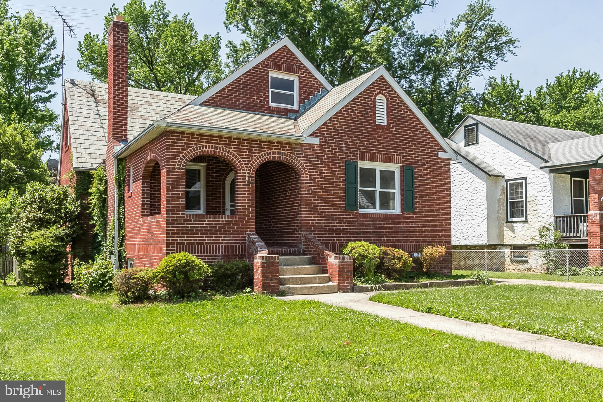 Red-brick charmer with original detail and modern comforts! In-lay floors throughout the main level, sep dining, huge eat-in kitchen with island, stainless & granite! Main-level corner bed, newly renovated master suite upstairs, lower level IN-LAW suite off of spacious basement. Sep garage, great back porch screen ready! Off St parking! CAC! This one will go fast!