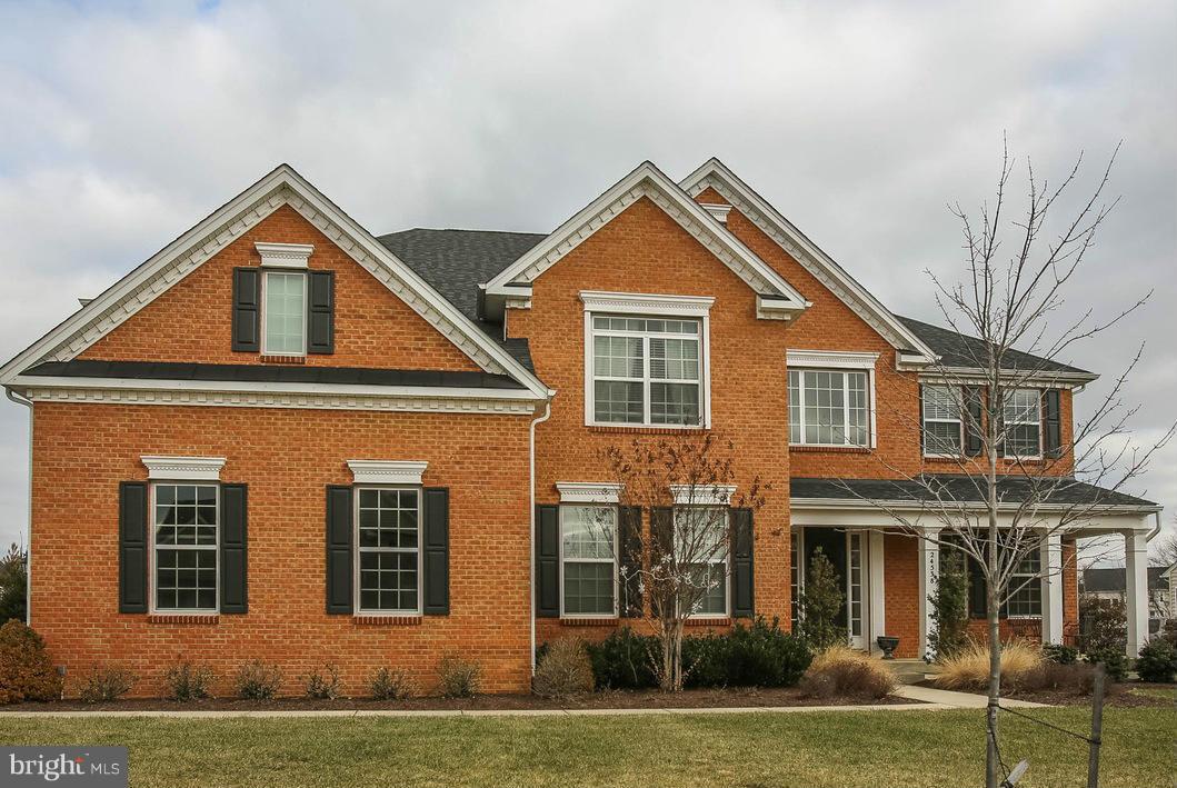 Fantastic home with water views, large deck and stone patio with fireplace for outdoor entertaining. Gleaming hardwood floors, gourmet kitchen, high end finishes all around, 3 car side load garage.  Large finished lower level with ample storage and entertaining areas. Generous 2nd level with Master Retreat, 3 additional bedrooms and 2nd family room loft!