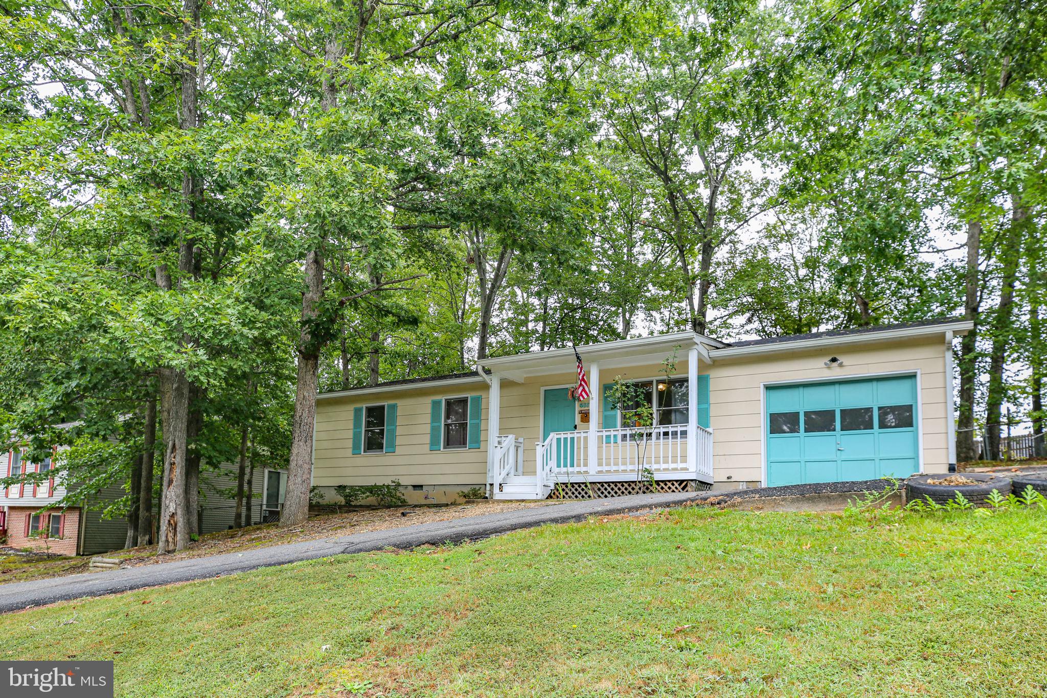 Welcome to your new home in a convenient neighborhood to Spotsylvania Courthouse and Fredericksburg. This home offers comfortable living with living room, eat in kitchen, three spacious bedrooms and 1.5 bathrooms. The kitchen was renovated in 2012.  Relax in the three season room off the kitchen. Recent updates include paint and carpeting ( 2024 ). Park in the one car attached garage with interior access. The backyard is fenced, and the driveway was resurfaced in 2015. You will love sitting out on the  front porch. Take advantage of the home's proximity to shopping and restaurants at Spotsylvania Courthouse.