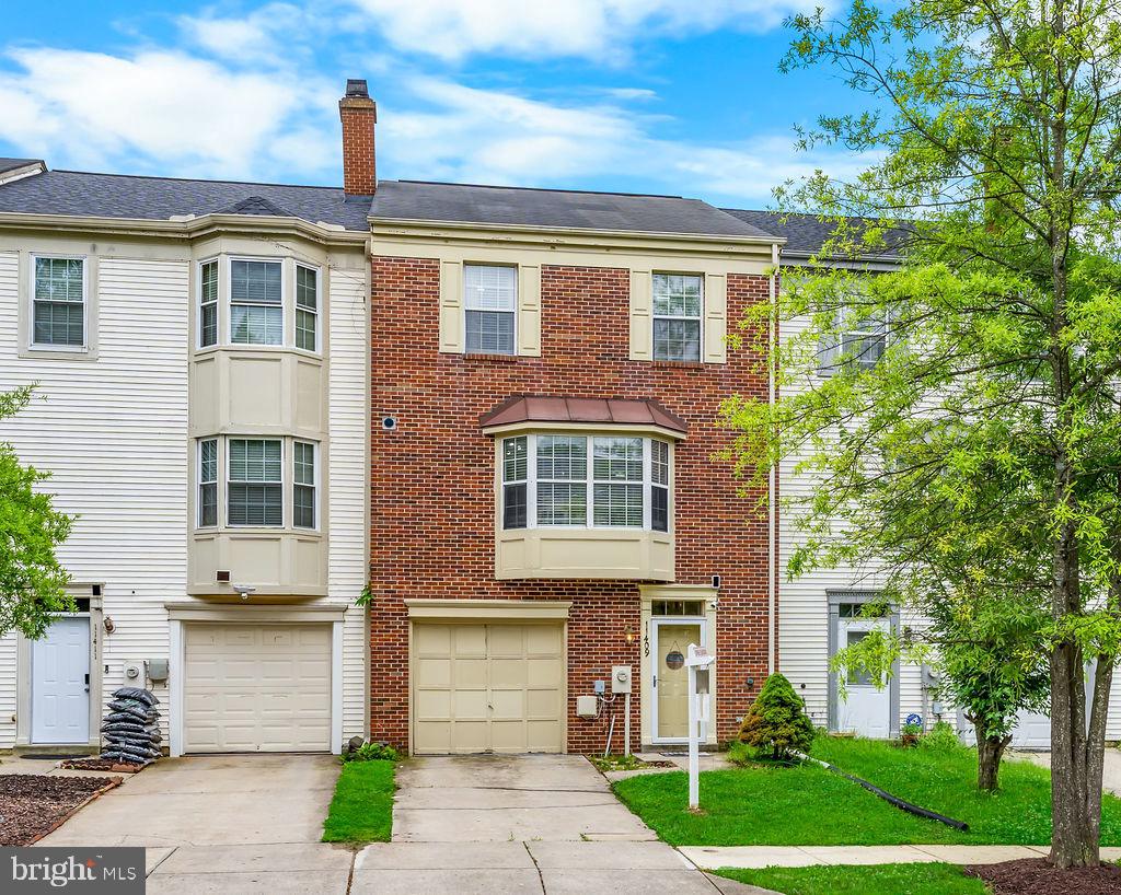 Beautifully maintained brick-front 3-level garage townhouse located in the sought-after Montpelier Hills community! This spacious 3-bedroom, 2 full-bath, 2 half-bath home offers the perfect combination of comfort, style, and convenience. Step inside to discover gleaming wood flooring throughout the main level and an updated kitchen featuring modern finishes, ample cabinetry, and great prep space for everyday living and entertaining.

The open-concept living and dining area is highlighted by a cozy fireplace and sliding glass doors leading to a private deck—perfect for relaxing or hosting guests. Upstairs, the generously sized primary suite features a spa-like bath complete with a Jacuzzi soaking tub, separate shower, and huge walk-in closet. Two additional bedrooms and a full bath complete the upper level.

The finished lower level provides flexible living space ideal for a recreation room, home office, gym, or media area, along with garage access and additional storage. Conveniently located between Baltimore and Washington, DC, this home offers easy access to the Baltimore-Washington Parkway, Fort Meade, NSA, and BWI Airport, making commuting a breeze. Close to shopping, dining, parks, and more!