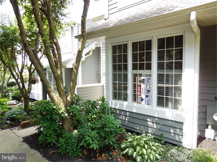 Beautiful and immaculately maintained townhome! Enjoy the nearby amenities such as Marsh Creek State Park and Lake just steps away. You'll also love the community pool, club house, tennis courts and health club that are all included. What a great way to live! The home itself offers quite a bit as well. There are 2 very spacious bedrooms and two full baths on the second floor. The eat-in kitchen was recently renovated with granite counters and island and new appliances. The living room with a fireplace opens to the outside world through the two sliding glass doors that lead to a wonderful deck. On the lower level is a large finished basement area that has been used as a third bedroom. This finished area has twin sliding glass doors that lead to a private patio. There's also a full bathroom and spacious finished laundry area and storage room. This home provides a stress free living style in a beautiful setting.