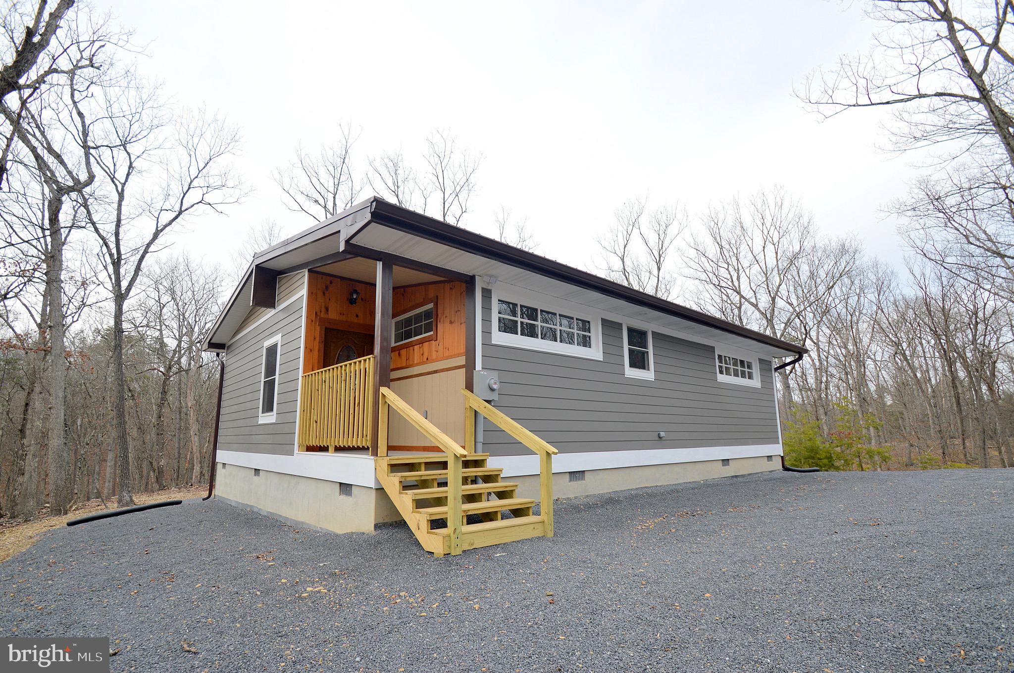 Remarkable newly built cabin.  Much thought and consideration went into this custom built cabin.  Outside features 3 plus wooded acres, a metal rood, hardi plank siding, and a shed with electric. Real barnwood trim accents adorn the interior.  Tile flooring on the screened porch and in the bathrooms are nice touches.  Mini split units provide heat and cooling.  A central focal point is the beautiful wood accents and breakfast bar.  Tongue and groove pine and cedar really make the look fantastic.  Lots of natural light from the windows also.  Full sized laundry room, and a conditioned utility space are bonus features.  All of this and in a great location also.....schedule your appointment today!