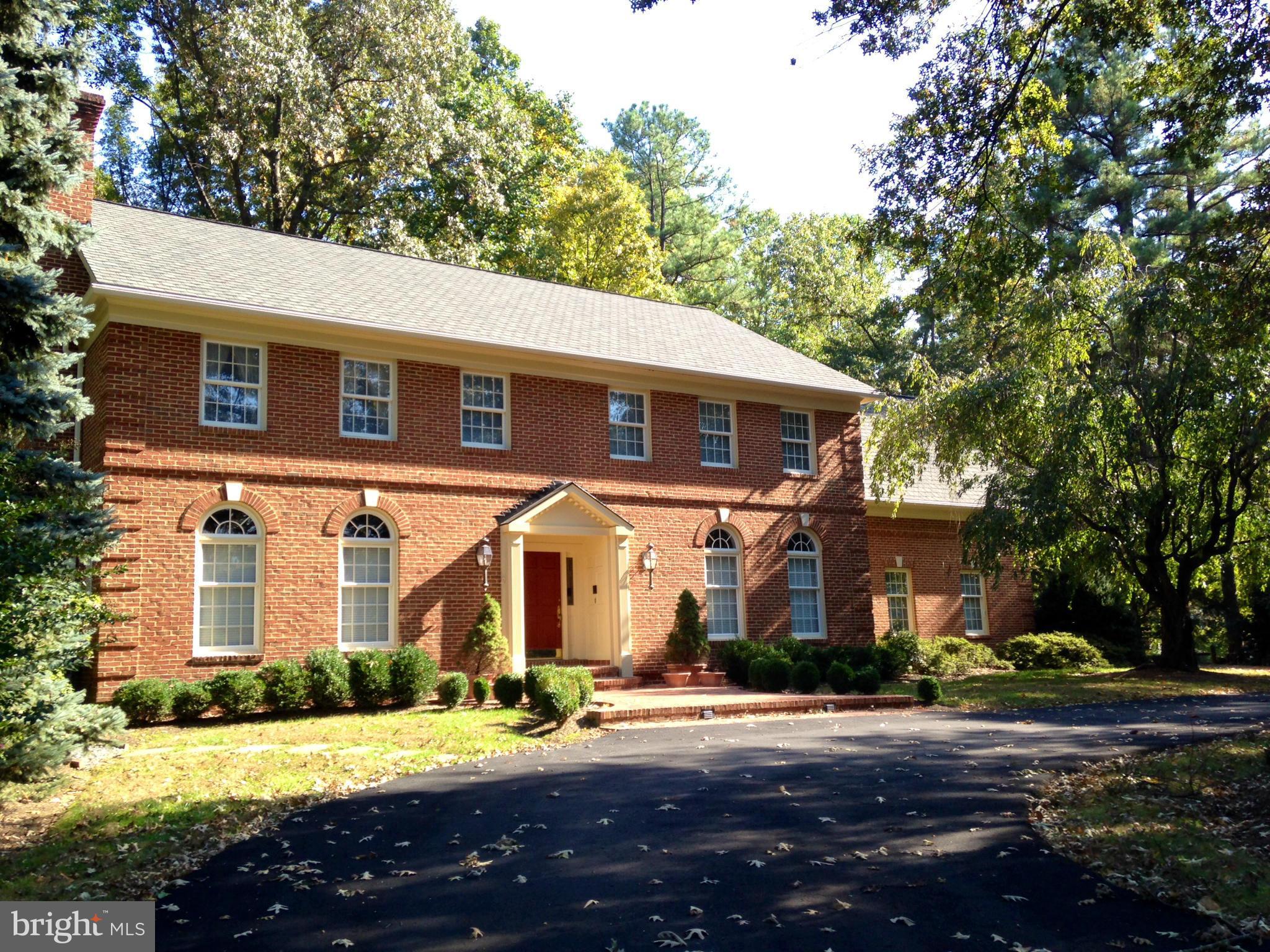STATELY ALL BRICK COLONIAL ON A LARGE LOT IN SOUGHT AFTER SUMMERWOOD * WITHIN A MILE OF THE NEW TYSONS METRO * NINE FOOT CEILINGS * RICH MOULDINGS * HARDWOODS ON MAIN & UPPER LEVELS * CIRCULAR DRIVE & 4 CAR DETACHED GARAGE W/ UNFINISHED 2ND FLOOR * FAMILY RM & SUN ROOM ADJOINING KITCHEN * FIVE FIREPLACES * FRONT & BACK STAIRS * MASTER SUITE W/SITTING RM & FIREPLACE, THREE CLOSETS & LUXURY BATH