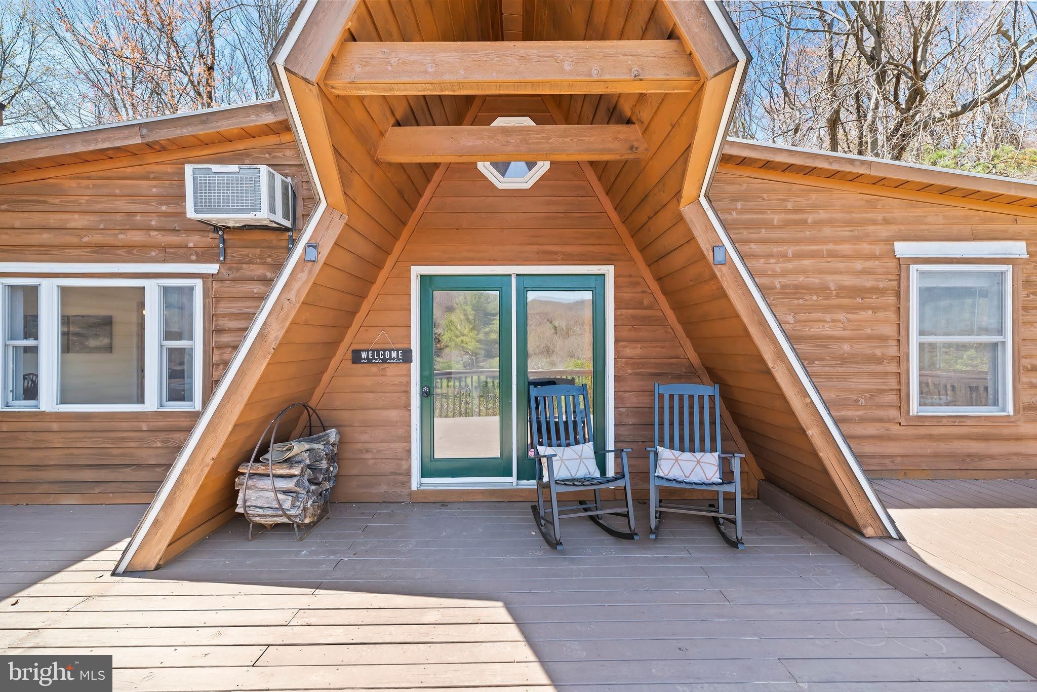 Welcome to your own slice of mountain paradise with this beautifully
renovated A-frame nestled next to Shenandoah National Park on nearly 2
private acres. This 3-bedroom, 1-bathroom with cozy loft home, blends
rustic charm with modern comforts, offering stunning panoramic views
of the Blue Ridge Mountains from nearly every angle. Step inside to
discover a bright and airy interior featuring soaring ceilings and a
completely updated kitchen and bathroom. The spacious living area
expands seamlessly into a bonus family room, with even more
opportunities to gather and relax outdoors on the expansive deck
—perfect for sunsets, or stargazing under clear mountain skies. Proven
as a highly successful short-term rental, this property consistently
earns outstanding reviews and generates substantial rental income. 

Its prime location provides easy access to popular outdoor
attractions—paddle along the scenic Shenandoah River, hike countless
trails within the national park, explore the famous Luray Caverns,
enjoy horseback riding adventures, or bike along the picturesque
Hawksbill Greenway. Afterwards, unwind in Luray’s charming downtown
area, featuring delightful cafés, farm-to-table restaurants, and
unique boutiques. Beyond the natural wonders, nearby vineyards,
festivals, and year‑round events add small‑town charm and steady
visitor appeal—an ideal mix for full‑time living, a weekend retreat,
or a high‑performing short‑term rental. 

Don’t miss your chance to own this picture-perfect property just minutes from Shenandoah National
Park, Skyline Drive, and all that the Shenandoah Valley has to offer.
This sale includes home on LOT H35 as well as LOT H34 with a combined total size of approx. 1.77 acres.

(Neighboring Lots H36, H37, H48, H49 are also listed for sale and can be combined
as a package deal)