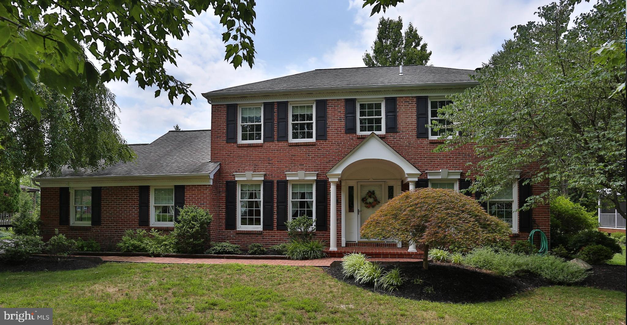 Welcome to 13 Bedford, a well maintained 4 bedroom colonial in the desirable Durham Lea community within the award winning Council Rock School District. A welcoming foyer with hardwood flooring, elegant wainscoting that continues into the formal dining room, and neutral paint throughout create a warm and inviting first impression. The formal living room and dining room provide the perfect setting for entertaining, while the sun filled family room features a fireplace, recessed lighting, and an abundance of natural light from oversized windows and sliding glass doors leading to the rear deck. The spacious kitchen offers granite countertops, a classic subway tile backsplash, ample cabinetry, and a bright breakfast area with access to the attached garage and the partially covered deck, making indoor and outdoor entertaining effortless. A convenient first floor laundry and powder room complete the main level.  The second floor features a spacious primary suite with a private sitting room, walk in closet, remodeled en suite bathroom, and access to additional crawl space storage. Three additional generously sized bedrooms share a hall bathroom. The partially finished basement provides flexible living space for a recreation room, playroom, or home office, while the unfinished section offers an ideal workshop and abundant storage. Outside, enjoy the private backyard which provides the perfect space for relaxing, dining, or entertaining in every season.    This is one of the few lots in the community which backs up directly to woods.  Conveniently located just minutes from Newtown Borough, shopping, restaurants, parks, major roadways, and train stations, this home offers the perfect combination of comfort, space, and location. Don't miss out; book your appointment today.