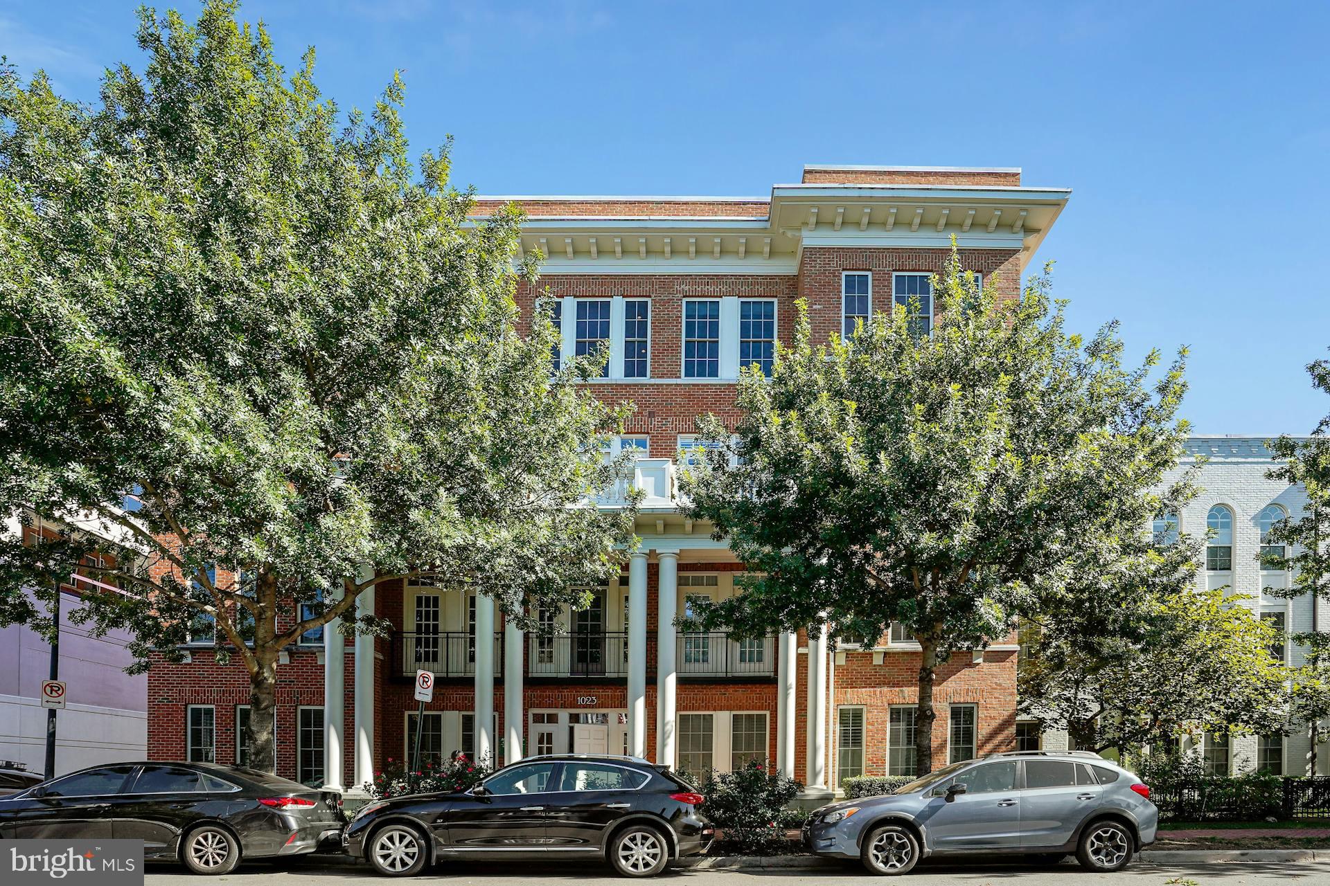 Stunning and spacious top floor, luxury condo; filled with natural light, and situated in fantastic Old Town location! Just two blocks to the bike/walking path along the Potomac River, and to waterfront parks. Steps to wonderful shops, restaurants, and grocery, in the highly sought after North end of Old Town. And only two lights to National Airport and DC! Beautiful open floor plan, gorgeous hardwood floors, nine foot ceilings, elegant crown molding, and a rare, private outdoor rooftop patio. Bright living room opens to kitchen, and is surrounded with ample sized, South and West facing windows, for lovely views, and an abundance of sunlight. The pristine kitchen has granite countertops, a large island, perfect for gathering with friends and family, an eat-in area, rich cherry wood cabinets, recessed lights, and stainless steel appliances with gas cooking. The immaculate primary bedroom has ceiling fan, generously sized windows, a walk-in closet, and a primary bath with delightful tile, a tub/shower, and vanity with granite top. The second bedroom is a fabulous space, and is perfect as a guest suite, child's room, den or home office. An exquisite leaded glass door opens to a bonus sitting room/sun room, with French doors that lead to a beautiful, private outdoor terrace. Add a garden, sip your morning coffee, enjoy your evening beverage, dine al fresco, and relax and take in sunset and City views, on your charming patio. A true outdoor oasis! Two garage parking spaces, and two storage bins! Walk to all the conveniences the North End of Old Town offers; fantastic restaurants, great shops, tennis, tot lot, dog park, fitness, coffee shops, theatre, art studios, farmers market's, Trader Joe's, Harris Teeter, and much more! Minutes to Metro, The Pentagon, National Landing, 395 and 495.  Easy one level living, in this stylish, top floor corner unit. Just move right in!