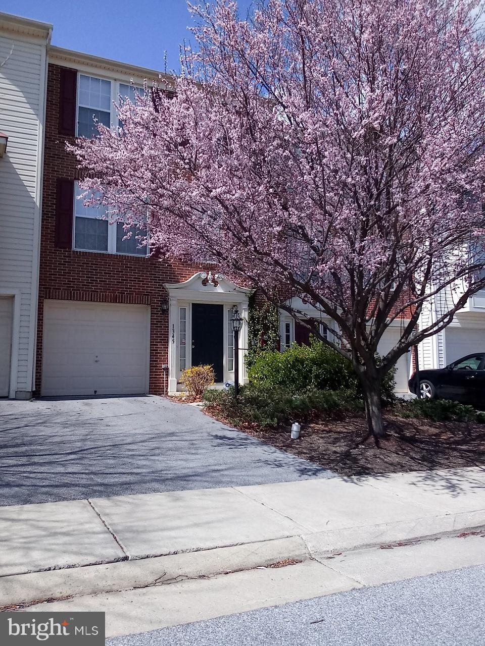 Beautiful brick 3 story town home in Fairfax Crossing featuring 3 bedrooms 2.5 baths, spacious sunroom/kitchen area, finished rec room in main level, 1 car garage, fireplace, washer/dryer, trash included and HOA mows the backyard!