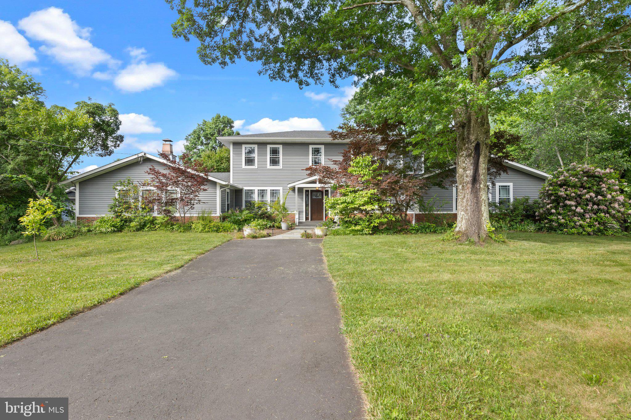 Serenely nestled on 4.4 bucolic acres, (1 1/2 acres fenced) this totally remodeled and expanded home is now over 4100 sq ft ...Private but  just minutes from New Hope and Peddlers Village. Quality workmanship and materials throughout. The Stunning Great Room (35x 23) with Cathedral ceiling, beams, see-thru floor to ceiling fireplace, custom wet bar great and beautiful oak floors. The Gorgeous gourmet kitchen is perfect for entertaining with 2 dishwashers, 2 ovens, a warming drawer, double sinks, 2 Refrigerators  (one beverage), a 53 sq ft Island with prep sink and seating , Quartzite counter tops, tons of cabinets and window seating. There are 4/5 spacious bedrooms, with 2 of them master suites (one on the first floor).  Four full baths all with heated floors and heated towel racks. The large 1st floor Office, Den or 5th bedroom allows for great flexibility if working from home. You'll find many special, well thought out features throughout the home - "Smart" lighting, wood floors throughout (some with custom in-lays), great moldings, finished basement (800Sq ft) , Electric outlet in garage for EV charging, central vac ,a large beautiful deck off the 2nd floor master,  home generator & much more! The 36 x36 garage has height enough for your RV, Boat or 6 cars! Stone terraces, Gazebo, fencing, great views, beautiful gardens.... Fruits trees and berries, specimen trees and shrubs, beautiful perennials and spring bulbs . Even make your own Beer- hops growing on the rear wall of the garage.
Replaced state-of-the-art septic system, Geo-thermal heating/cooling with low electric costs (approx $200 month), Roof reinforced for future solar panels (with conduit pipes installed). Home was rebuilt and expanded from original ranch from the studs - everything was replaced. Basically a less than 10 year old home.
 Wider doorways downstairs for handicap accessible.