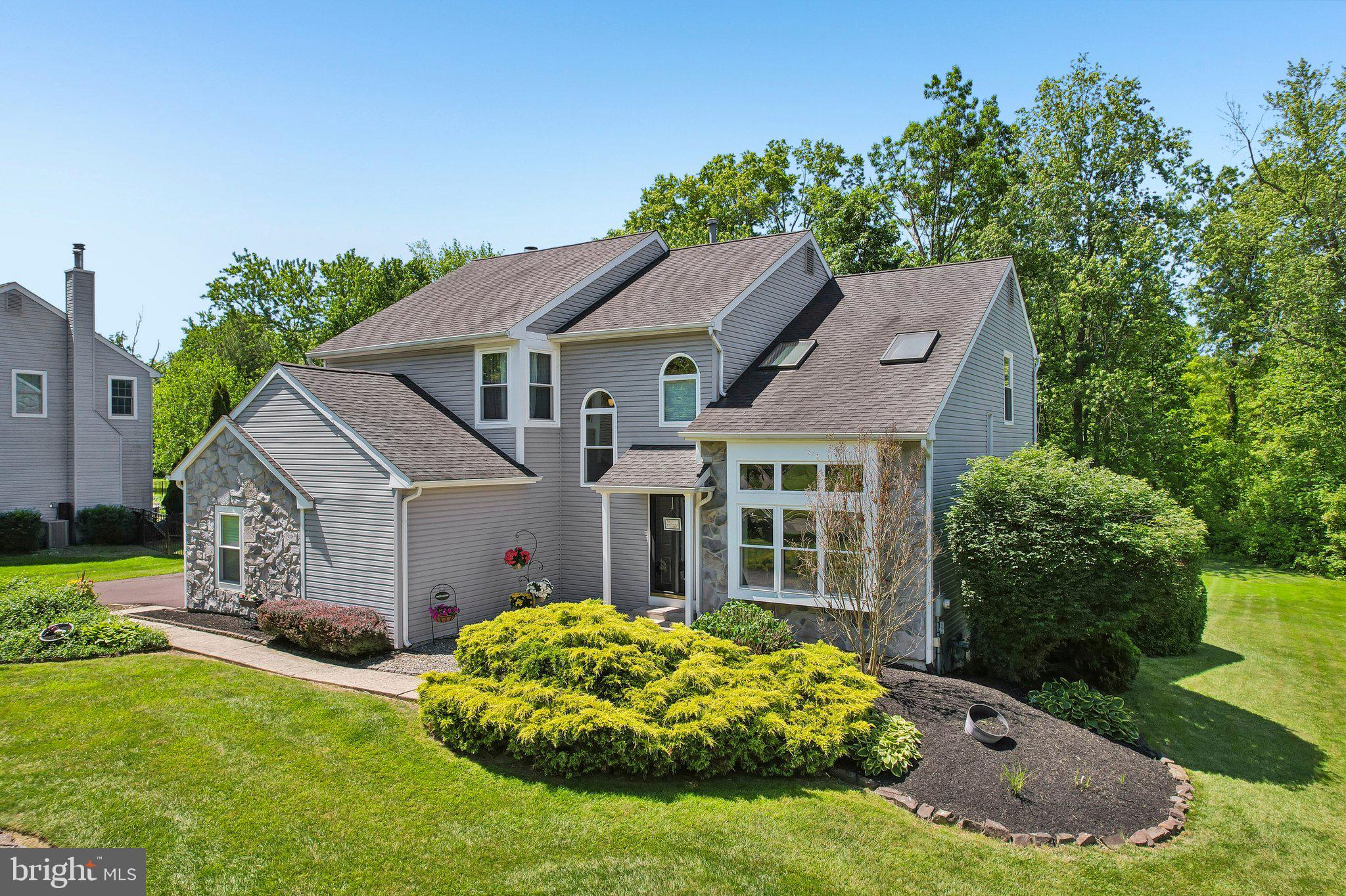 Welcome to 30 Andrew Lane, where light-filled contemporary living meets nearly an acre of peaceful Montgomery Township beauty.
Set on a picturesque homesite backed by mature trees and neighboring farmland, this beautifully refreshed 4-bedroom, 2.5-bath Contemporary offers a rare combination of architectural character, modern updates, and everyday convenience. Tucked within one of Montgomery Township's most established and desirable neighborhoods, you'll enjoy a setting that feels worlds away while remaining just minutes from Montgomeryville, Lansdale, shopping, dining, parks, and major commuter routes.
From the moment you arrive, the home's attractive curb appeal, mature landscaping, and side-entry two-car garage create an inviting first impression. Step inside and you'll immediately appreciate the soaring ceilings, dramatic natural light, and open layout that make this home feel both welcoming and unforgettable.
Fresh paint, updated luxury vinyl plank flooring, renovated baths, and thoughtful improvements throughout create a truly turnkey opportunity. Oversized windows frame views of the mature rear landscape while filling the home with natural light from morning until evening.
At the heart of the home, the spacious eat-in kitchen overlooks both the family room and the peaceful backyard beyond. Gather around the fireplace accented by custom built-ins, host holiday dinners in the formal dining room, or simply enjoy everyday moments in a floor plan designed for connection and comfortable living.
The living room's vaulted ceilings and striking window design create an impressive focal point, while the finished lower level offers valuable additional space for recreation, fitness, hobbies, media, or play.
Upstairs, the primary suite provides a relaxing retreat complete with a beautifully updated bath and walk-in closet. Three additional bedrooms offer abundant natural light, generous closet space, and the flexibility today's buyers seek for family, guests, home offices, creative pursuits, or future needs. Overlooking the foyer and living spaces below, the second level enhances the home's open architectural feel while maintaining privacy where it matters most.
Step outside onto the brand-new deck and enjoy summer evenings, morning coffee, or weekend gatherings overlooking the expansive backyard and wooded backdrop. It's the kind of outdoor space that invites you to slow down, unwind, and stay awhile.
Whether you're searching for more room to grow, a home that is truly move-in ready, or a neighborhood you'll be proud to call home for years to come, 30 Andrew Lane delivers exceptional value, timeless appeal, and a lifestyle that is increasingly difficult to find. Room to Grow. Ready to Enjoy. Make your appointment today