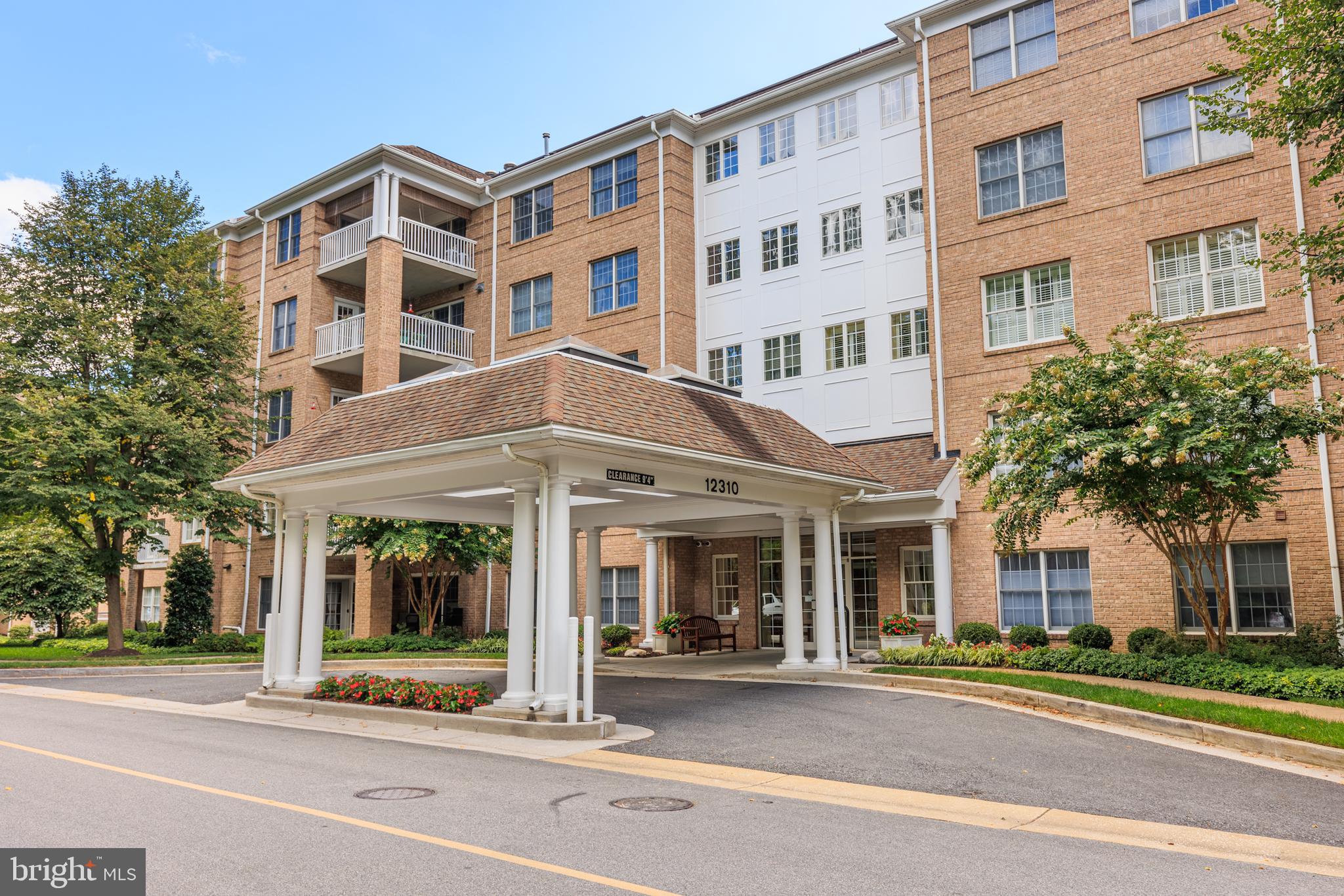 WELL MAINTAINED TOP FLOOR UNIT WITH SECLUDED BALCONY FACING WOODED COMMUNITY GREEN SPACE AT REAR OF BUILDING - this oversized 2 bedroom condo features an open floor plan with wood floors throughout, separate dining room and spacious eat-in kitchen offering granite countertops and new ss appliances leading to breakfast nook with private balcony.  The large living room has soaring vaulted ceilings and a gas fireplace, large owner's bedroom with oversize walk-in closet and connecting bathroom.  Separate laundry room and mechanical room with recently replaced hvac system and water heater.  Additional storage locker just down the hallway from the unit, secured garage parking and elevator building - pride in ownership by original owner!