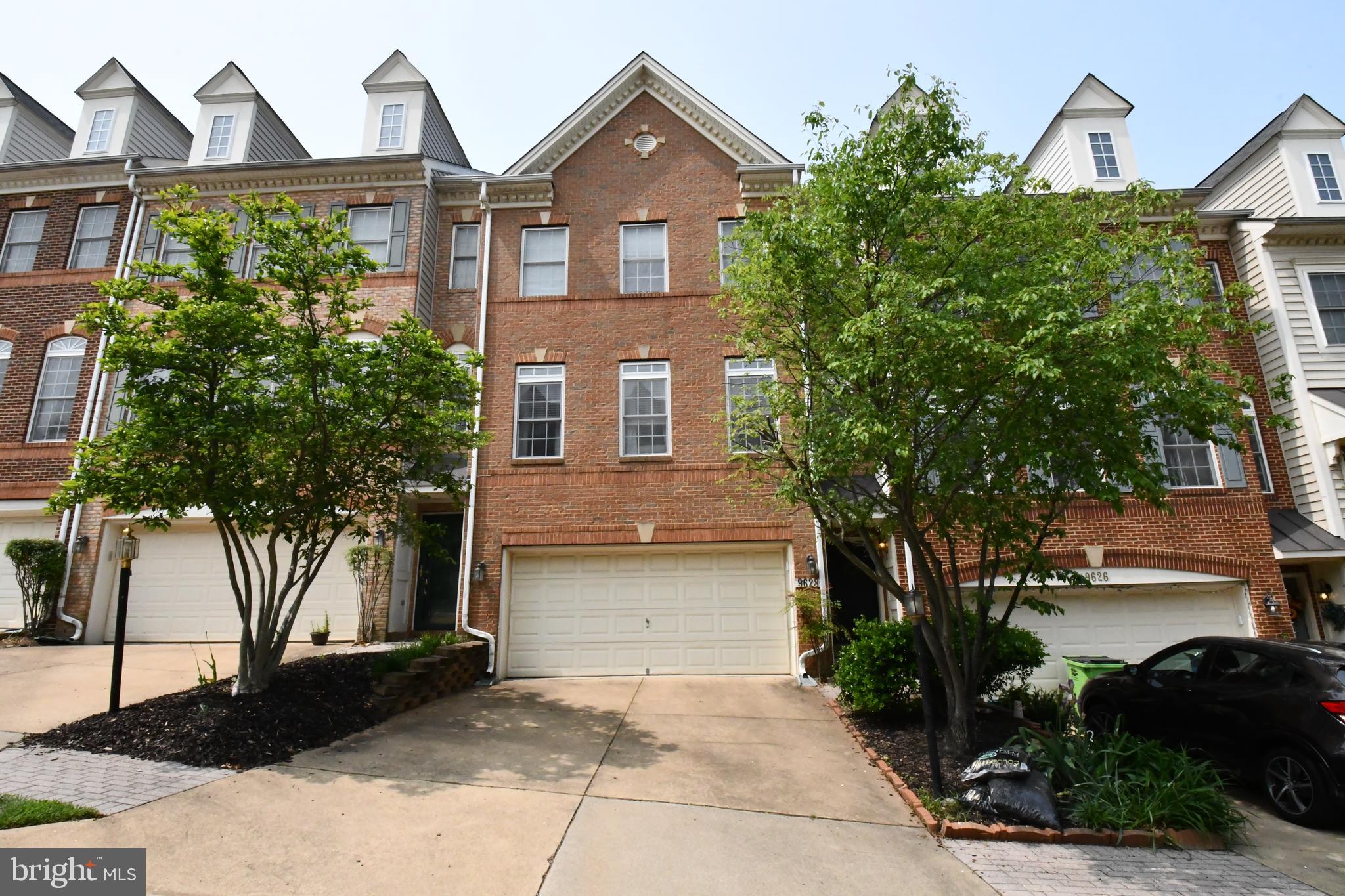 Gorgeous 3 level Brick Front Townhome with 2 Car Garage! Lots of natural light! Fantastic location, walkable to Lorton Marketplace - (New Amazon Fresh) restaurants and general needs.   Main level features beautiful wood floors and crown molding. Upgraded Kitchen, with white shaker cabinets and quartz countertop which is open to a separate dining room.  As well, the kitchen leads to spacious deck with a fenced in yard. Great flow for entertaining! 3rd level features 3 bedrooms, Primary bedroom has vaulted ceiling, primary bath with jacuzzi tub and separate shower, and 2 separate vanities. 
 Large fully finished lower level is perfect family room, office, or gym with walkout to yard, garage access, and large windows for natural light. Easy to commute from this location with I-95 and VRE with in 1 mile and Fairfax County Parkway, and Fort Belvoir within minutes.   Gunston Hill offers great amenities-community pool, tennis courts, playgrounds, and more.  Pets will be considered on a case-by-case basis. No cats.