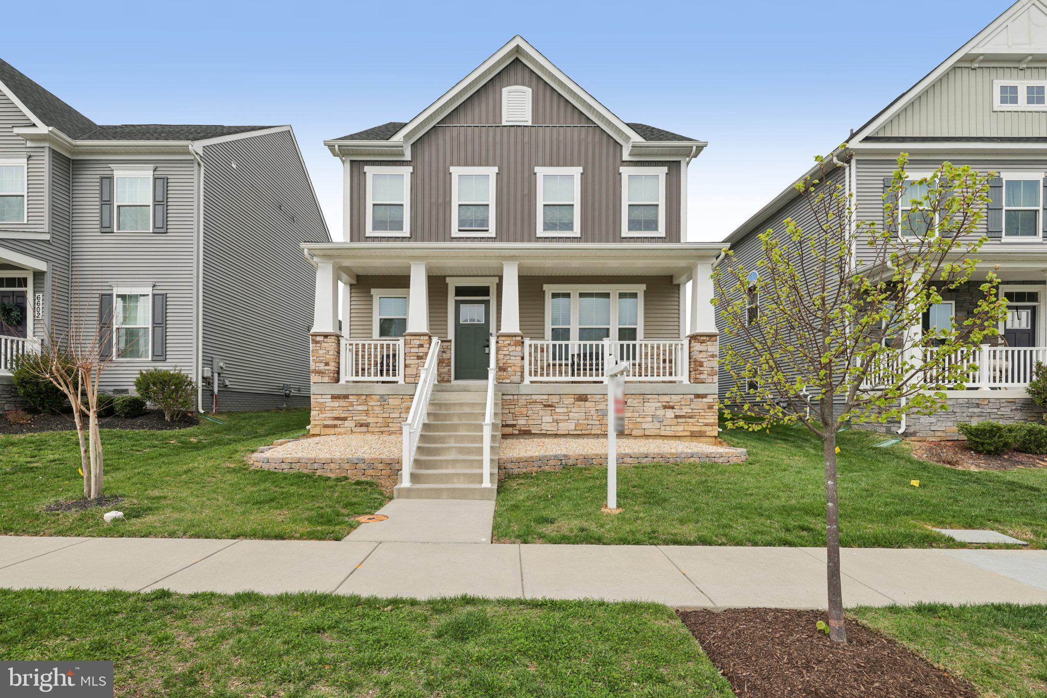 Welcome home to a bright and inviting home that has it all...literally! The original owners not only had this home built, but they also purchased ALL of the options the builder had to offer. The main level is designed for both everyday living and effortless entertaining as the kitchen opens to the large living room with high ceilings. Warm wood flooring and a clean, modern palette create an immediate sense of comfort, while the open flow between spaces allows for easy connection whether hosting guests or enjoying a quiet evening in. Natural light fills the home, highlighting the thoughtful layout and stylish finishes throughout. Upstairs, you’ll find well-appointed bedrooms that offer a peaceful retreat at the end of the day. The primary suite features a spacious layout complemented by a beautifully designed en-suite bath with dual vanities, sleek fixtures, and a glass-enclosed shower—creating a spa-like atmosphere. Additional bedrooms provide flexibility for a variety of needs, all tied together with a fresh, neutral aesthetic. The upper level also features a laundry room for easy and convenient access. The finished lower level is where this home truly shines. Expansive and versatile, it’s ready to become your ultimate gathering space—perfect for movie nights, game tables, or a comfortable lounge area. Recessed lighting, plush carpeting, and generous square footage make it feel like a natural extension of the home. A private bedroom and full bath on this level add even more flexibility, ideal for guests or additional living arrangements, along with bonus storage and tucked-away spaces for added convenience. Step outside to enjoy the covered rear porch—an inviting spot for morning coffee or evening relaxation. The backyard offers manageable green space for outdoor enjoyment, while the home’s attractive exterior, and well-kept setting complete the package. The attached garage spares no detail as the floors were professionally epoxied and are so clean, you could eat off them. This home was meticulously cared for and is waiting for you to call it home. Located conveniently near major commuter routes, shopping, restaurants and is just minutes from Downtown Frederick (while remaining outside of City taxes).