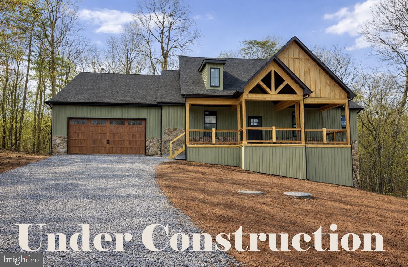 Late summer delivery!
This beautifully designed 4-bedroom, 3.5-bath home offers the perfect blend of elegance, comfort, and functionality in a peaceful, wooded setting. The exterior highlights a stylish mix of stone and siding, creating a timeless and elegant curb appeal. Highlighted interior features include a split-bedroom layout with a spacious primary suite that includes dual primary bathrooms — each with its own shower, sink, and toilet. The open-concept living area highlights a partial stone fireplace with shiplap accent, a formal dining room, and a dedicated office complete with built-ins. The kitchen will feature a large island, Quartz countertops throughout, and a stainless steel kitchen appliance package. 
Upstairs, the loft provides an additional bedroom and bathroom. The unfinished basement with combo safe room offers plenty of potential with a walkout to the backyard and storage. Enjoy outdoor living on the beautiful Sunroom and 8 x 24 composite back deck or relax on the welcoming front porch, surrounded by mature trees for privacy and serenity.
Hospital less than 5 minutes away and just minutes to Cacapon Resort State Park where residents can enjoy access to golf, dining, walking trails or visit downtown Berkeley Springs and more. Don’t miss your chance to make this incredible new home yours!

Under Construction close to hospital & amenities.

"Please note: The photos shown are of a similar completed home. The specific home may vary in floor plan, finishes, or upgrades. The builder reserves the right to substitute materials that may not be available to avoid delays."