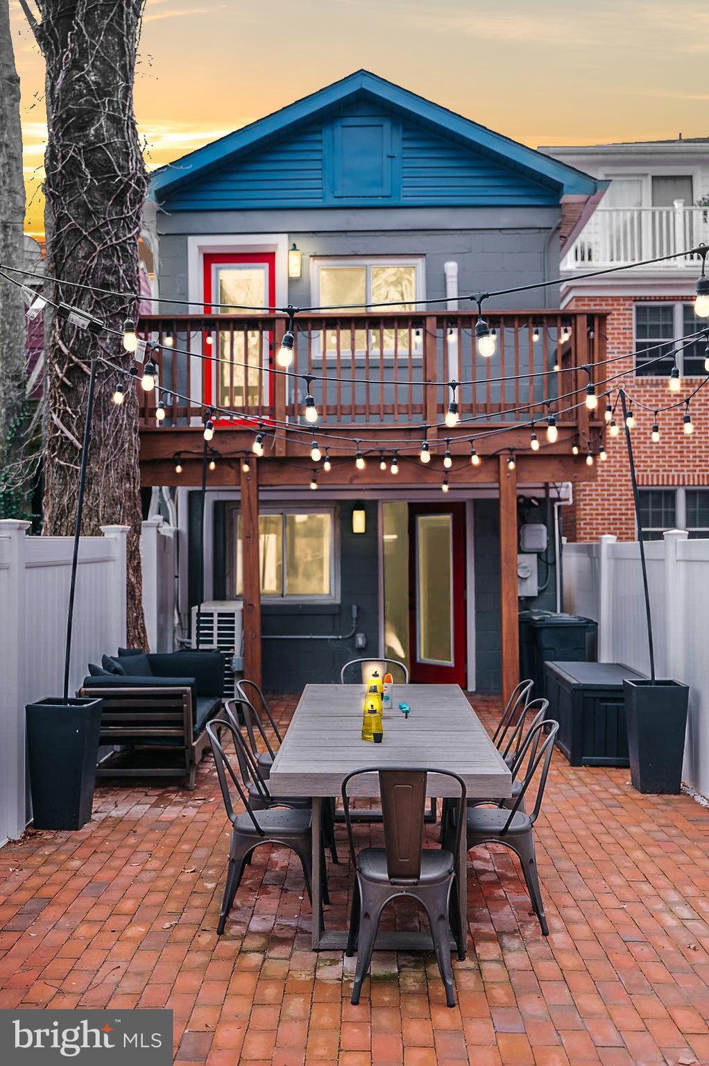 Welcome to 220 West Street in Annapolis, Maryland. A rare, fully gut-renovated detached property located in the heart of the Downtown Arts District at a row home's price, offering exceptional flexibility with mixed-use zoning that allows for both residential and commercial use.

Completed in 2024, this property has been completely transformed from top to bottom. Every major system and finish has been replaced, delivering a true turnkey opportunity for buyers seeking lifestyle, investment potential, or business use in one of the most walkable and desirable areas in Annapolis.

Unlike the majority of Downtown Annapolis properties, this is a fully detached home, not a rowhome or townhouse, providing enhanced privacy, natural light, and a more versatile footprint.

The extensive renovation includes a brand new roof, all new electrical and plumbing systems, a new high-efficiency mini-split HVAC system, redesigned floor plan, new flooring throughout, updated lighting, and fully rebuilt kitchen and bathrooms. The outdoor spaces have been completely upgraded with a new deck, new brick patio pavers, new fencing, and ambient lighting that creates a warm and inviting atmosphere for evening entertaining.

Inside, the home features a bright two-story entry foyer and a professionally curated interior design that blends modern comfort with intentional functionality. With three bedrooms and two full bathrooms, the layout is flexible enough to support full-time living, guest accommodations, workspace needs, or commercial adaptation.

The main-level primary suite opens directly to a private brick patio, while the second bedroom features access to a rear deck overlooking the fully fenced yard. These indoor-outdoor connections are rarely found in Downtown Annapolis and significantly enhance livability.

The kitchen has been completely reimagined with new cabinetry, countertops, and appliances, designed to support both daily living and entertaining. The open dining area comfortably accommodates gatherings, reinforcing the home’s versatility.

Adding even more value, this property is being sold fully furnished. Every piece has been professionally selected, allowing the next owner to move in immediately, operate as a short-term rental, or transition into a commercial or mixed-use setup with minimal effort.

Historically, this property has served multiple purposes, including a furniture store, office space, and duplex residence, highlighting the true flexibility and long-term value of its mixed-use zoning designation.

Step outside into a fully fenced private yard featuring a brick patio, outdoor dining area, lounge seating, and ambient lighting, creating a unique urban retreat just steps from the energy of Downtown Annapolis.

Located just moments from restaurants, shops, nightlife, City Dock, the Maryland State House, and the U.S. Naval Academy, this property offers unmatched walkability and access. With convenient proximity to Baltimore, Washington D.C., and BWI Airport, it is equally appealing for commuters, investors, and second-home buyers.

This is more than a home. It is a rare, fully renovated, detached mixed-use opportunity in Downtown Annapolis where lifestyle, flexibility, and long-term value align.