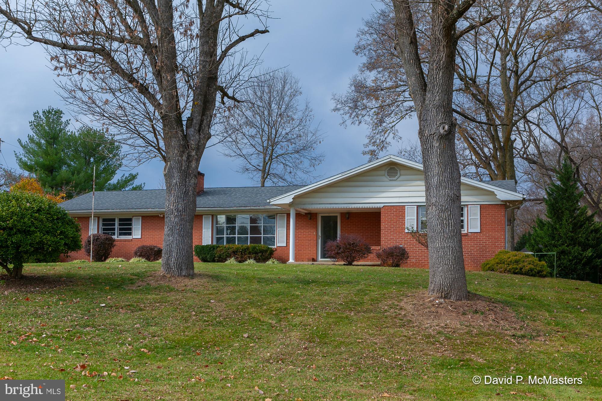 LARGE BRICK RANCHER WITH LOTS OF SPACE - HOME HAS 3 BEDROOM AN2 FULL BATHS-KITCHEN A FORMAL DINING -HARDWOOD  FLOORS-LAUNDRY AND GARAGE 1 STEP IN-2 FIREPLACES 1 WOOD WITH INSERT-2 L/P GAS IN SOLARIUM  APROX 592 SQ FT-WITH STORAGE ROOM BEHIND WHICH GOES TO PATIO-FULL BASEMENT WITH 2 UNFINISH ROOM-AN 1 LARGE REC ROOM WITH WOODSTOVE - HOME NEED TLC AND  DATED- BUT REMOLDELING  NOW AND BE A HEAD OF REAL ESTATE GAME- OPINION ONLY- THAT HOME WILL NOT GO GOVT. LOANS-