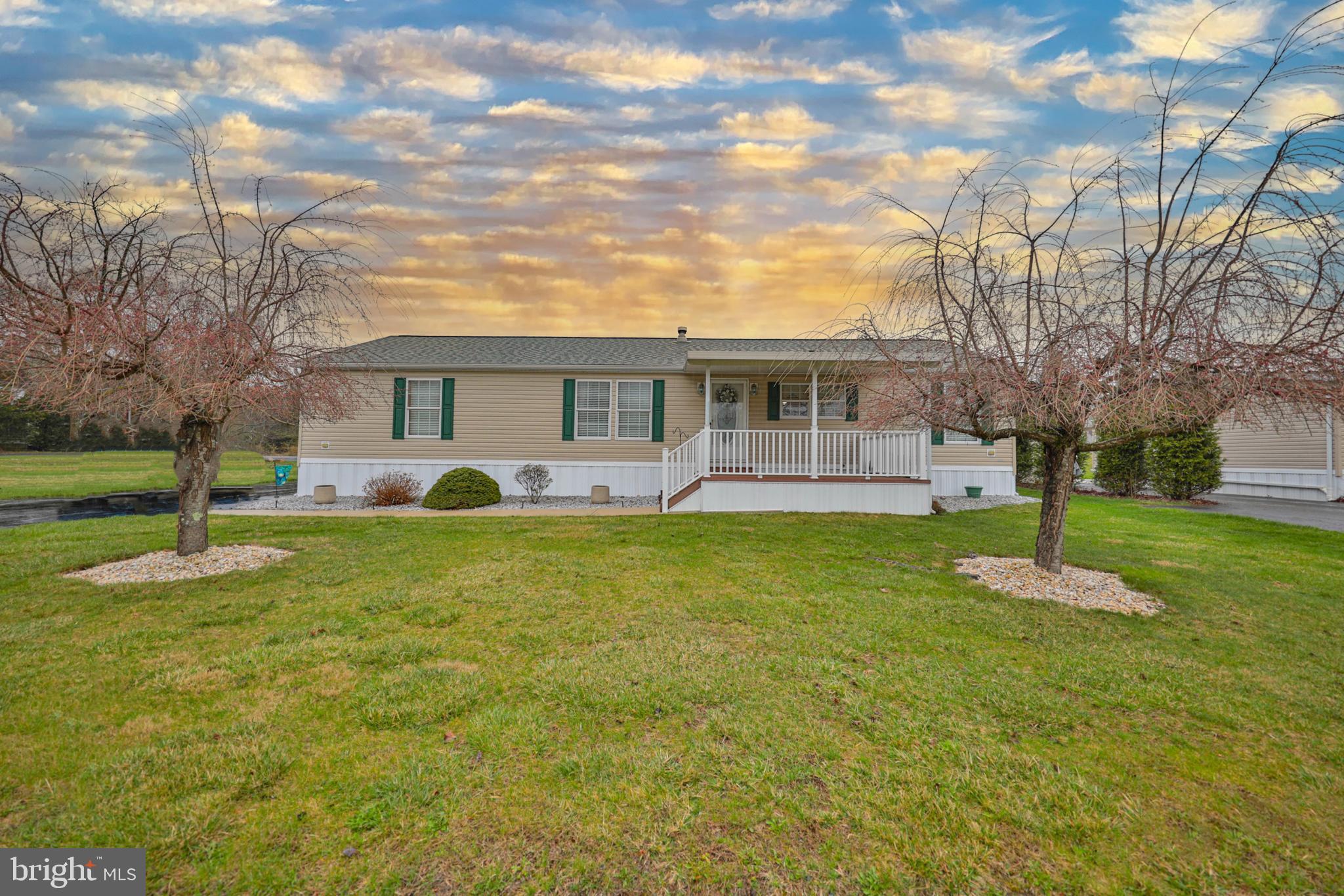 NEVER JUDGE A BOOK BY IT’S COVER . . . Prepare to be ”WOWED” the moment you step into this spacious 3-BR, 2 BA ranch home located in the community of Northside Heights. This Champion “Gold Medal” home is loaded with almost every upgrade available! The open floorplan, stone propane fireplace and built-in cabinetry welcomes you the moment you walk into the home. Custom kitchen features a wood hearth electric cooktop, double ovens, 8' center-island with stainless sink that seats 3 and stainless appliances! An oversize master bedroom & master bath includes garden tub, double vanity sink, 48" stand up shower & walk-in closet. 2 equally size bedrooms and full bathroom on the opposite side of the home for your privacy. WELL MAINTAINED! Roofs replaced on home in (2018) Garage & shed (2020), toilets replaced with 18" high toilets and new kitchen faucet are a few of the recent improvements to the home. A covered (10' x 13') front deck, detached (14' x 30') garage and (12' x 20) shed, both with electric are added bonuses! Included with the sale of the home is a Craftsman tractor, snow blower, patio set with chairs and wood sleigh bed, dressers located in the master bedroom.  $520/mo. lot rent incl., W/S/G & community pool and other amenities. BUYERS: Please make sure you're approved for manufactured home financing. VA, FHA, USDA or Conventional mortgages will not qualify for these homes. Call listing agent with any questions. Call today!
