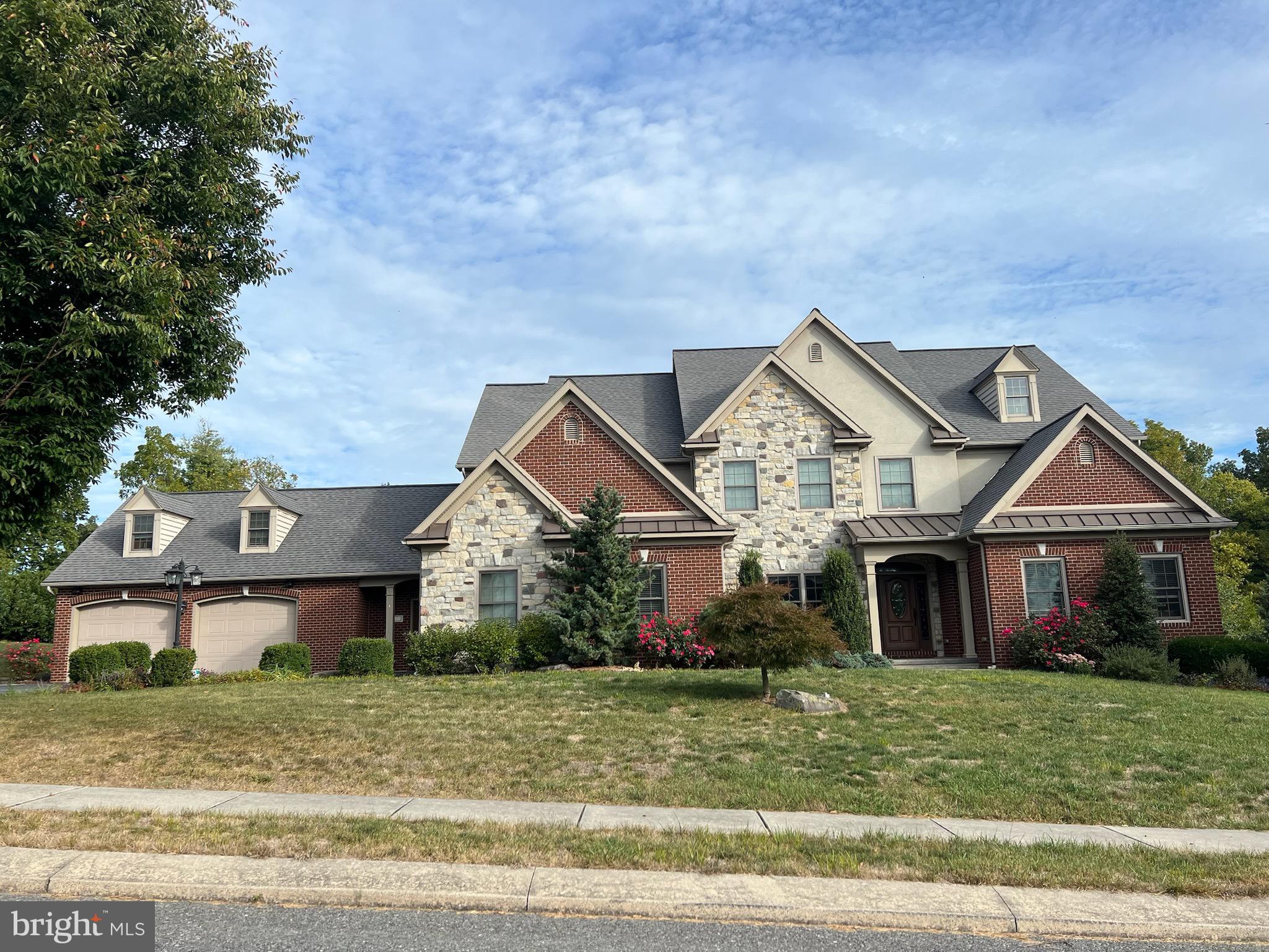 Custom built and professionally designed home on 1.15 acres set with a preserved farm and trees behind for the ideal country setting yet the amenities of natural gas and public sewer…..and close to town. 6 oversized bedrooms, 5.5 baths, and closets with custom shelving….all but 1 bedroom have walk in closets as well.
The primary bathroom boasts separate sink areas as well as a a custom steam shower with bench and heated walls plus a full body shower system. The bedroom is designed so that an early riser can shower,  dress and leave without disturbing the lucky one who gets to sleep in. 
5 1/4” baseboards and 3.5 “ casings thruout the home. 9 ft+ ceilings thruout the home…even the basement finished area has 8.5 ft ceilings.
The main living space is open and vaulted with impressive finishes. The gourmet kitchen boasts 2 dishwashers, 2 microwaves,  2 ovens, a gas and an electric cook top, 2 sinks with one in the stand out island complete with double-stacked chiseled edge granite counter top. The breakfast bar seats 8 and the stools will remain and an adjacent dining area offers even more seating for a large crowd. Large walk in pantry is the cooks delight. 
The 2 story greatroom with gracious chandelier and the second story overlook boasts unique curved railings and contemporary square pickets. The double sided gas fireplace and double French doors lead to the sunroom…a vaulted space with heated floors and access to the screened porch. But you’ll never want to leave with the 5.1 surround sound and 4 speakers built into the ceiling…subwoofer connection in rear wall.
Tray ceilings and crown molding in the primary bedroom and diningroom which also boasts wainscoating.
The hardwood in the gracious entry follows thru the diningroom and first floor office…or homeschooling space….so many uses what can this space be for you? 
Upstairs you will find 4 bedrooms and 3 bathrooms, 2 window seats and every bedroom has a walk in closets….the only problem is they may never want to leave!
So many details I can’t list them all but you’ll fall in love with the mud area conveniently located off the kitchen with access to the garages, laundry room, half bath and the back porch. 6 custom built in lockers and extra storage will help keep you organized .
The lower level is an entertainers dream…generous sports bar and the fridges, keg system, stools, tables and more stay…the foosball, pool table, ping pong and 4 TVs all stay too. A full bath and an extra bedroom or playroom offer so much flexibility and the mirror lined exercise room…no need to go to the gym. While the equipment doesn’t stay the floor mats do. The entire finished basement also has heated floors for warmth and comfort.
But wait….the back yard paradise is accessible from the lower level as well as the open level covered porch with a 2 sided stone/wood burning fireplace. Watch the roaring fire from the hot tub which stays and be cozy even in the snow this winter.
The in ground salt water pool is complete with a waterfall and spill over spa as well as color changing LED lighting all enclosed with a beautiful aluminum fence.
In case you don’t have enough garage space with 4 oversized bays there is a shed for your mower. And over the garages you’ll find walk up attic space …a generous 42 x 15.
A must see as there is so much to see and quality to appreciate.Please note that owners recently won a tax assessment appeal so taxes listed here are the new ones for 2025 and going forward!