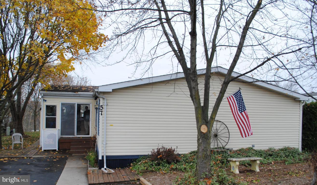 Quiet, friendly OVER 55 community surrounded by farmland. Many Upgrades! Must see to appreciate all the improvements since 2004 (totalling over $34k). Huge rooms, closets galore and under home storage! 1989 Schult 28x57 with 10x20 all-seasons room with porch swing and 4x12 back deck w/gazebo. 42'' TV in Family Room stays! See 35 pics/list of improvements! 2 Small dogs OK. Ready to move in.
