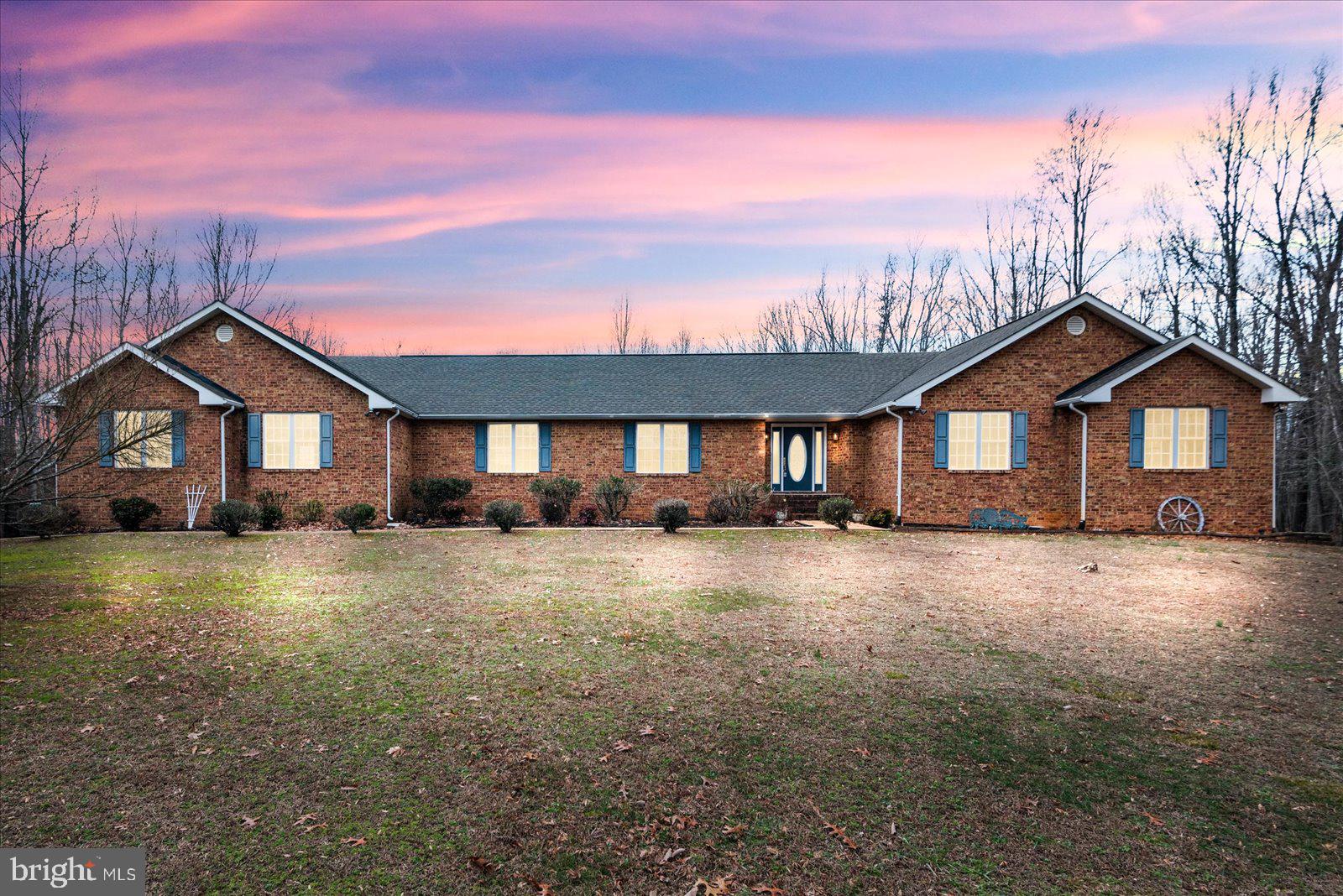 This property is a dream come true! The 5,600 sq. ft. brick rambler offers so much versatility, including a basement apartment with a full kitchen and private entrance—ideal for extended family or rental income. The interior shines with gleaming wood floors, updated bathrooms, and a separate dining room perfect for entertaining. Generous bedrooms provide plenty of comfort, while the large family room and screened porch add even more living space.

The 7.5-acre fully fenced lot, with no HOA, is a haven for outdoor enthusiasts—bring your livestock or enjoy the open space! The oversized attached garages and separate detached garage with a dog kennel area provide incredible functionality. The double 10-ft gate and included ia generator for the main floor and zero-turn mower are thoughtful extras. All of this, just minutes from Louisa shopping and a short drive to Charlottesville—this property truly has it all!"