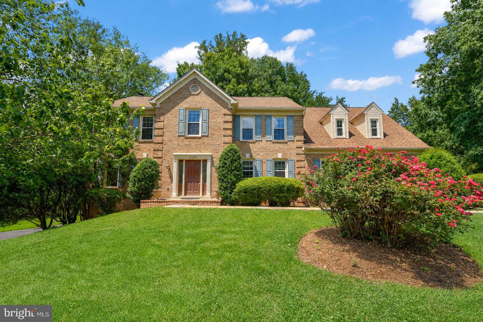Beautiful brick-front single-family home in sought-after Fairview Woods, perfectly situated on a picturesque, park-like ½+ acre lot with stunning wooded views. This spacious home offers 6 bedrooms, 4.5 bathrooms, and a side-load 2-car garage. Freshly painted throughout, the home features hardwood flooring on both above-grade levels and brand-new luxury vinyl plank flooring in the lower level.
The main level offers elegant separate living and dining rooms, along with a well-appointed kitchen and breakfast nook that opens to the inviting family room with a cozy fireplace. Step outside to the expansive deck, ideal for entertaining, barbecues, and enjoying the tranquil natural setting.

Upstairs, you'll find 5 generously sized bedrooms and 3 full bathrooms, including a luxurious primary suite with a dual vanity, soaking tub, and separate shower. A private secondary bedroom with direct access from the garage provides an excellent opportunity for an in-law, guest, or au pair suite.

The walk-out lower level features a large recreation room, 6th bedroom, full bathroom, abundant storage space, and access to the private wooded backyard.

Recent updates include HVAC system, water heater, and windows (2021). Roof replaced in 2010. Ideally located near major commuter routes and the Burke Centre VRE Station, offering convenience and accessibility while maintaining a peaceful residential setting.