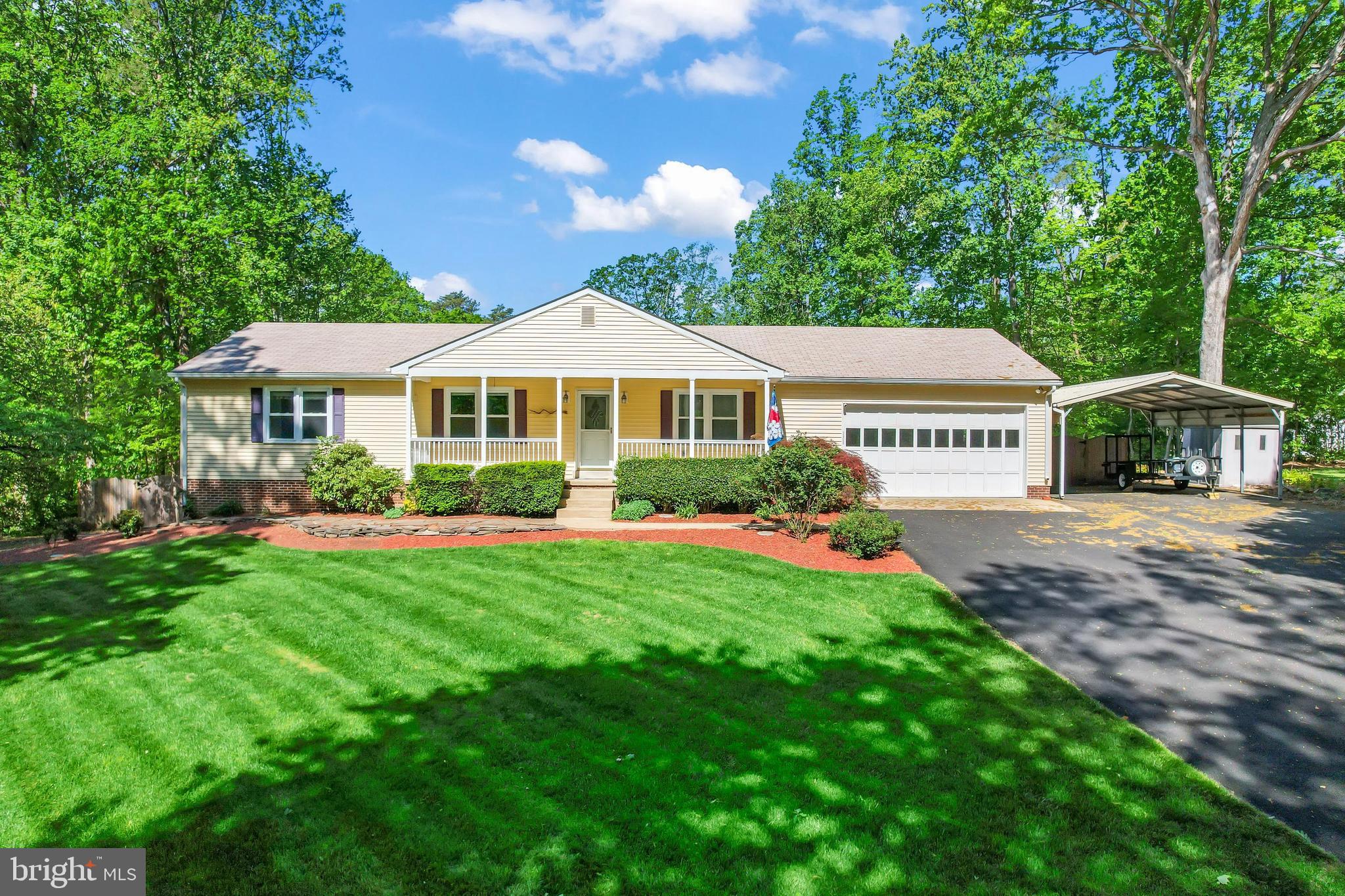 Welcome home! Don't miss this stunning 4 bedroom, 3 bath custom built Ranch Style home in the highly sought after Carriage Hill Estates subdivision! This beautiful home will impress you! Offering 2700 sq ft of total living space with a fully finished lower level nestled on a serene 1.18 acre lot touting a neighborhood immersed in pristine woodlands, offering the ultimate in privacy!  
 This alluring property starts with exquisite and vibrant landscaping throughout the estate, providing the inviting feel of country tranquility, while providing small town amenities close by. The back yard is a sanctuary of beauty, surrounding a large inground pool/hot tub, proving the ultimate swimming and relaxing experience totally fenced in for the ultimate in privacy. Adding to the appeal of the this wonderland is a magnificent Gazebo where guests can be entertained poolside never having to leave the peacefulness of this secluded utopia.
  After enjoying the incredible outdoor experience, enter the home directly into the main level where a spacious gourmet kitchen awaits with stainless steel appliances, updated wood cabinets, recessed lighting, and granite countertops providing the optimum culinary experience. The kitchen, dining room and living room combination provides for an open floor plan with upgraded flooring and large island being the glue that ties the area together. Relax in these appealing rooms while enjoying the warmth from a beautiful stone fireplace which provides the perfect ambiance for entertaining and social gatherings. Adding to the incredible lay out of the main level is an expansive laundry, primary bedroom with large closet, primary bathroom, two more bedrooms, a full bathroom and entrance to the large garage. Step outside of the primary bedroom onto sizable deck that overlooks the elegant landscaping and poolside oasis of peace. The amazing lower level touts an incredibly spacious recreation/theater room and kitchenette combination. There is fourth bedroom, large full bath and another room perfect for an office/den. Enjoy the additional storage sheds and large carport.
 Easy access to Route 234, Prince William Parkway, I-66, I-95 and the VRE. Plenty of shopping and dining choices are available in every direction including Historic Old Town Manassas, while outdoor enthusiasts will appreciate the many local parks including Prince William Forest Park offering 15,000 acres of woods, streams, fragile ecosystems, and endless activities for nature lovers. For an exceptional home in an idyllic setting, you’ve found it!