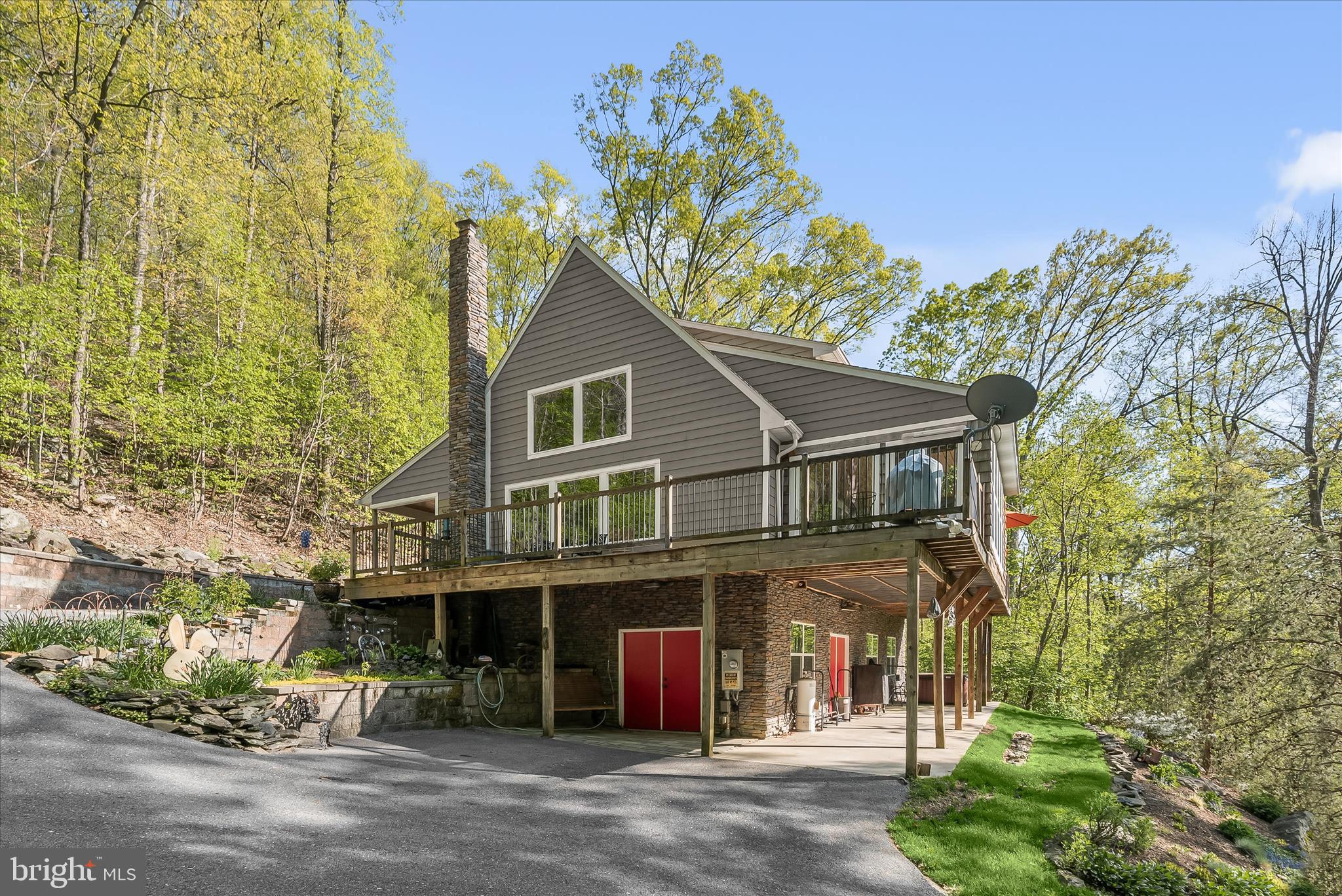 Welcome to 4623 Fishers Hollow Road, where thoughtful craftsmanship, efficiency, and timeless design come together on over 5 private acres in beautiful Myersville.

This custom-built 3-bedroom, 2.5-bath home offers over 2,200 square feet above grade plus a spacious lower level.

The main level features an open floor plan with dramatic two-story ceilings and seamless flow throughout. A propane fireplace with a beautiful stone chimney anchors the living room, while the dining area connects effortlessly to the kitchen and enclosed wraparound porch. Complete with a mini-duct system added in 2019, this porch is ideal for year-round enjoyment. The main-level primary suite offers both convenience and privacy, featuring an en-suite bath and direct access to a private porch overlooking the yard.

Upstairs, a functional loft overlooks the main living area and offers flexible space for a home office, reading nook, or additional living area. Two additional bedrooms and a full bath complete the upper level.
The lower level features soaring 10-foot ceilings, a workshop area, abundant storage, and walkout access. Double doors leading to the driveway provide excellent access for larger storage needs, hobby equipment, or recreational items.

Built for comfort and longevity, the home includes 5-zone radiant heated floors throughout, including the basement, paired with a 2-zone heat pump and a 95% efficient propane boiler for exceptional year-round efficiency. A wood stove and additional gas fireplace add warmth and character, while rich red oak trim and reclaimed wood sourced from a 200-year-old barn create timeless custom detail throughout.

Additional construction highlights include an ICF foundation, Rockwool insulation, 50-year shingles, low-drop sprinkler system throughout, and two 200-amp electrical panels. A substantial French drain system behind the home adds functionality, while a dedicated 240V outlet is ready for a future hot tub setup.

A rare combination of quality construction, thoughtful design, and peaceful surroundings—this is a truly special place to call home.
