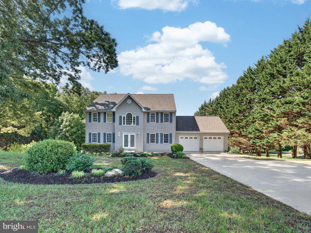 Welcome to 9290 Baker St, Owings, MD 20736, located in the desirable Ward Meadows community. Situated on a private 1.5-acre lot surrounded by trees, this spacious colonial offers plenty of room both inside and out.

The upper level features four bedrooms, including a large primary suite with a private bath, jacuzzi tub, separate shower, double vanities, and walk-in closets. Hardwood floors run throughout the main and upper levels.

The main floor includes a living room, formal dining room, family room with a fireplace and built-in shelving, a bedroom, and a half bath. The kitchen offers custom cabinetry, upgraded countertops, a stylish backsplash, and a casual dining area.

The finished walk-out basement includes a renovated in-law suite with its own kitchen, bedroom, living room, full bath, private laundry, and additional storage space.

Enjoy the peaceful backyard from the rear deck overlooking the wooded setting. Additional features include a two-car garage, extended driveway parking, and a convenient location close to shopping, restaurants, and major commuter routes.

A great opportunity to own a well-maintained home with space, privacy, and flexibility.
