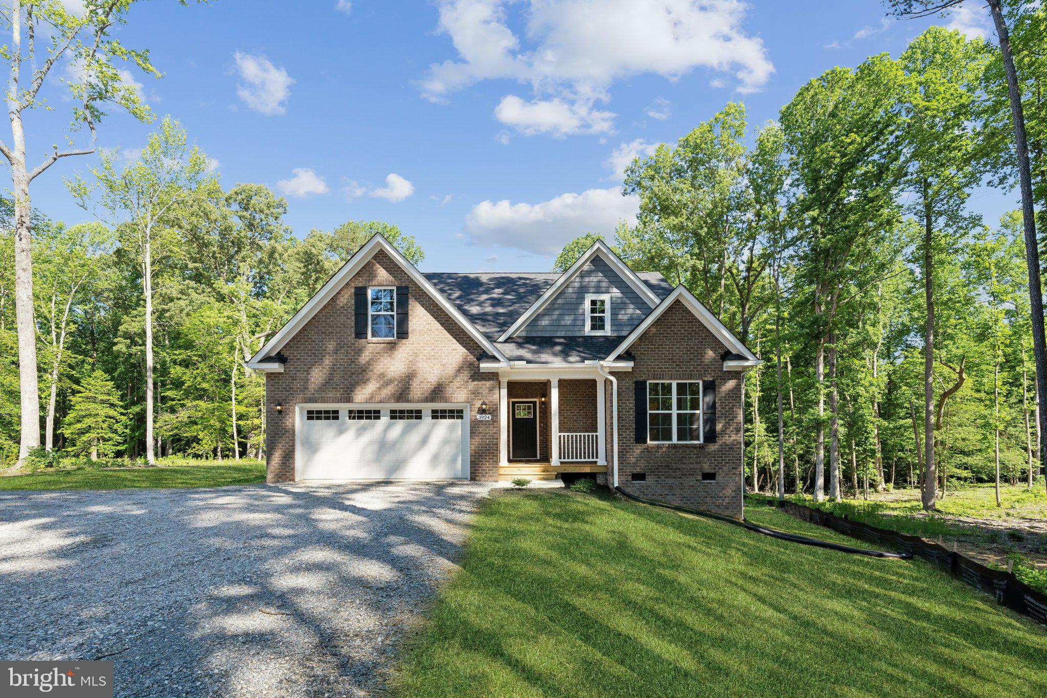Welcome to 3924 New Kent Highway, a charming one-story Brick ranch home featuring a bonus room and an additional 4th bedroom and full bath upstairs. Wonderfully private and set on a peaceful, nearly 3-acre lot. Despite its tranquil setting, it's only 20 minutes from the vibrant city of Richmond. The heart of the home is a large kitchen with an island perfect for dining, which opens to a spacious great room with vaulted ceilings. The primary bedroom offers a generous walk-in closet with shelving, and the luxurious primary bathroom boasts a huge double bowl vanity and a walk-in tile shower. High-end finishes, including quartz and granite countertops and luxury cabinets add elegance throughout the home. Step outside to the partially covered rear deck, perfect for relaxing in privacy.  As a Value-Added feature the builder has fully encapsulated the crawlspace. The home also features a convenient two-car garage. Experience the perfect blend of rural tranquility and modern luxury at 3924 New Kent Highway. SELLER OFFERING 2/1 LOAN RATE BUY DOWN W PREFERRED LENDER. Make this dream home yours today!