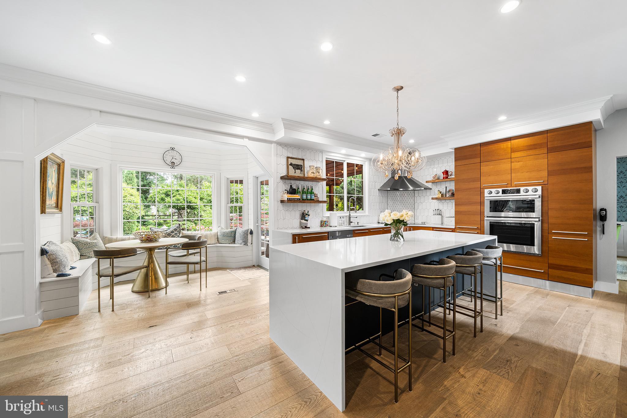Every detail of 1485 Charter Court reflects pride of ownership. Meticulously cared for by its original owners, this pristine property offers a seamless transition for its next chapter. The versatile first-floor layout features flexible living spaces designed to adapt flawlessly to your custom lifestyle. The heart of the home is undoubtedly the masterfully designed kitchen, where sleek wooden cabinetry contrasts beautifully with white quartz countertops. A sprawling central island offers comfortable seating for four, while a built-in breakfast nook serves as the perfect spot to dine while overlooking your private backyard oasis.
Upstairs, the second-floor hosts four generously sized bedrooms and two full baths. The primary suite serves as a luxury retreat, boasting an expansive walk-in closet and a magazine-worthy en-suite bath complete with an attractive green double vanity, elegant wallpaper accents, a standalone soaking tub, and a custom marble shower. Below, a fully finished basement offers flexible space for a fifth bedroom or an in-law suite, complete with an additional living area, a full bathroom, and a wet bar easily convertible into a second kitchen.
Outside, the professionally upkept grounds reveal an unparalleled backyard paradise. A rustic built-in pergola allows for year-round enjoyment, framed by beautifully blooming magnolia trees and a sparkling saltwater system pool. Premium upgrades include a multi-zone underground sprinkler system, a whole-house automatic gas generator, brand new-water heater (June 2026) and new water treatment system. Tucked away on an exclusive, nine-home cul-de-sac, the property backs directly to the serene expanses of Tamanend Park. Enjoy a peaceful sanctuary that is still within minutes of local shopping hubs, dining, Churchville Nature Center, and the newly expanded Rails-to-Trails network, alongside effortless access to major commuter routes. Bonus: To make this transition entirely seamless, all premium furniture and custom artwork can be included in the sale. A truly one-of-a-kind home waiting to welcome its next 30 year chapter.
