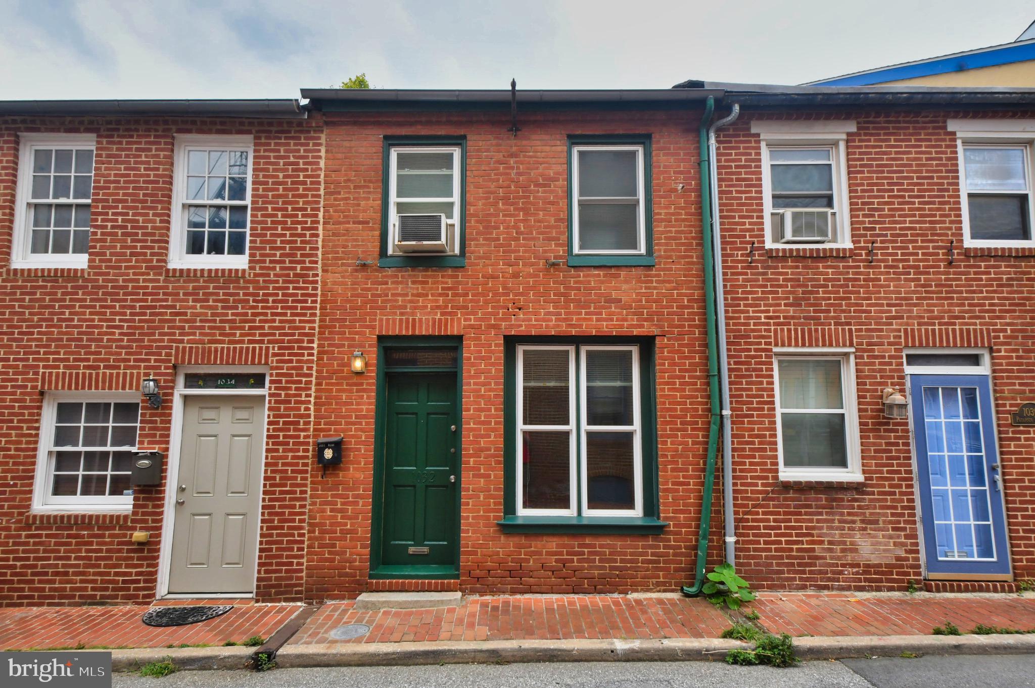 Main level Studio/1br in Federal Hill 1/2 block from the newly renovated Cross Street Market - Location Location!. Area 9 street parking. Brick hard surface flooring throughout. Living room features a decorative fireplace. Galley kitchen offers plenty of storage. Bedroom area is in the rear features exposed brick. Bedroom space can fit a queen sized bed. Back patio outdoor space. Free Wifi and Water are included in rent. Tenant pays BGE. Pets Considered On Case By Case Basis. Available Now!