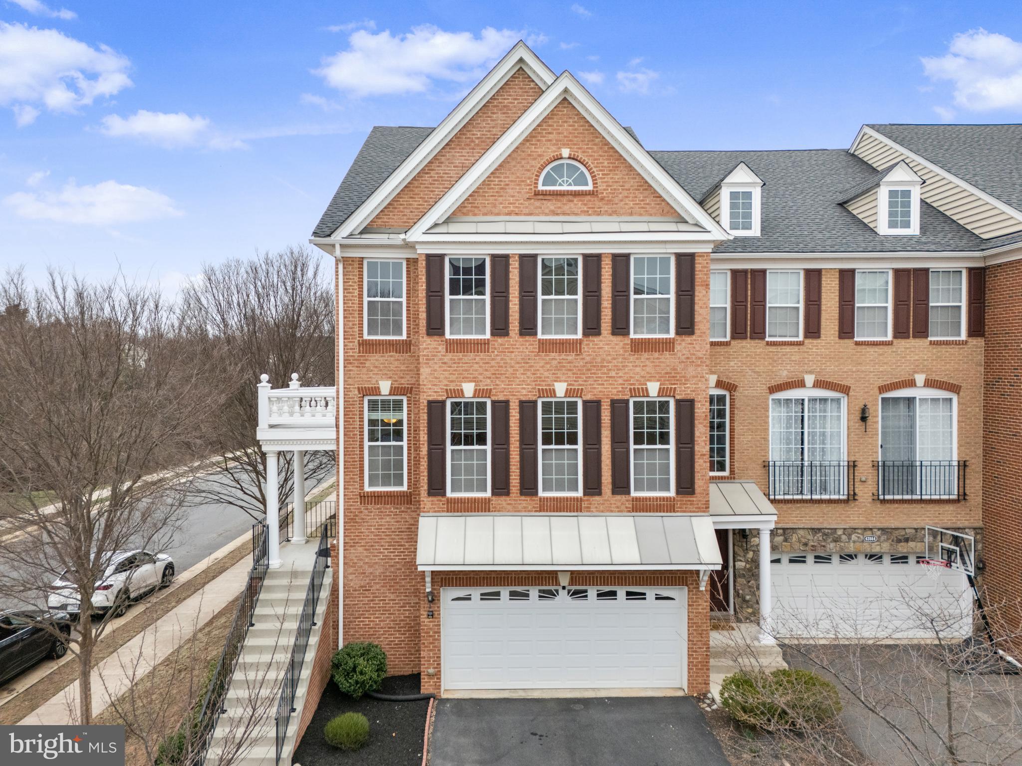 Freshly painted End-unit Luxurious Meadows Model Townhome with back to woods built by Toll Bros in Loudoun Valley Estates II. Corner lot and only 10 years young. It is a turnkey home with many valuable changes made in the very recent past. The attractive contemporary home features include a main level entrance, guests are always in awe of our gorgeous looking luxurious townhome with separating the living and dining room, cozy fireplace, lot of natural lighting and a huge family room which overlooks the sunny and bright deck. Upstairs include 3 bedrooms and 2 bathrooms. Spacious Master suite with walk-in closet, a luxury bathroom with a soaking tub and a standing tower, and each bedroom has a walk-in closet. Basement includes a spacious recreation spot for gatherings  with a home theater setup and full bathroom with access to backyard contains common area and trees. The home is having upgraded cabinets and countertoos and comes with a 2 car garage and a TREX deck. 2 car garage with driveway and tot-lot and large parking lot across the street. Access to all 3 LV2 club houses with swimming pools, basket ball courts, tennis courts and good school district. Close to Brambleton town center, Brambleton Park & Ride, silverline metro last stop, RT 28, RT 50  and Toll Road-267.