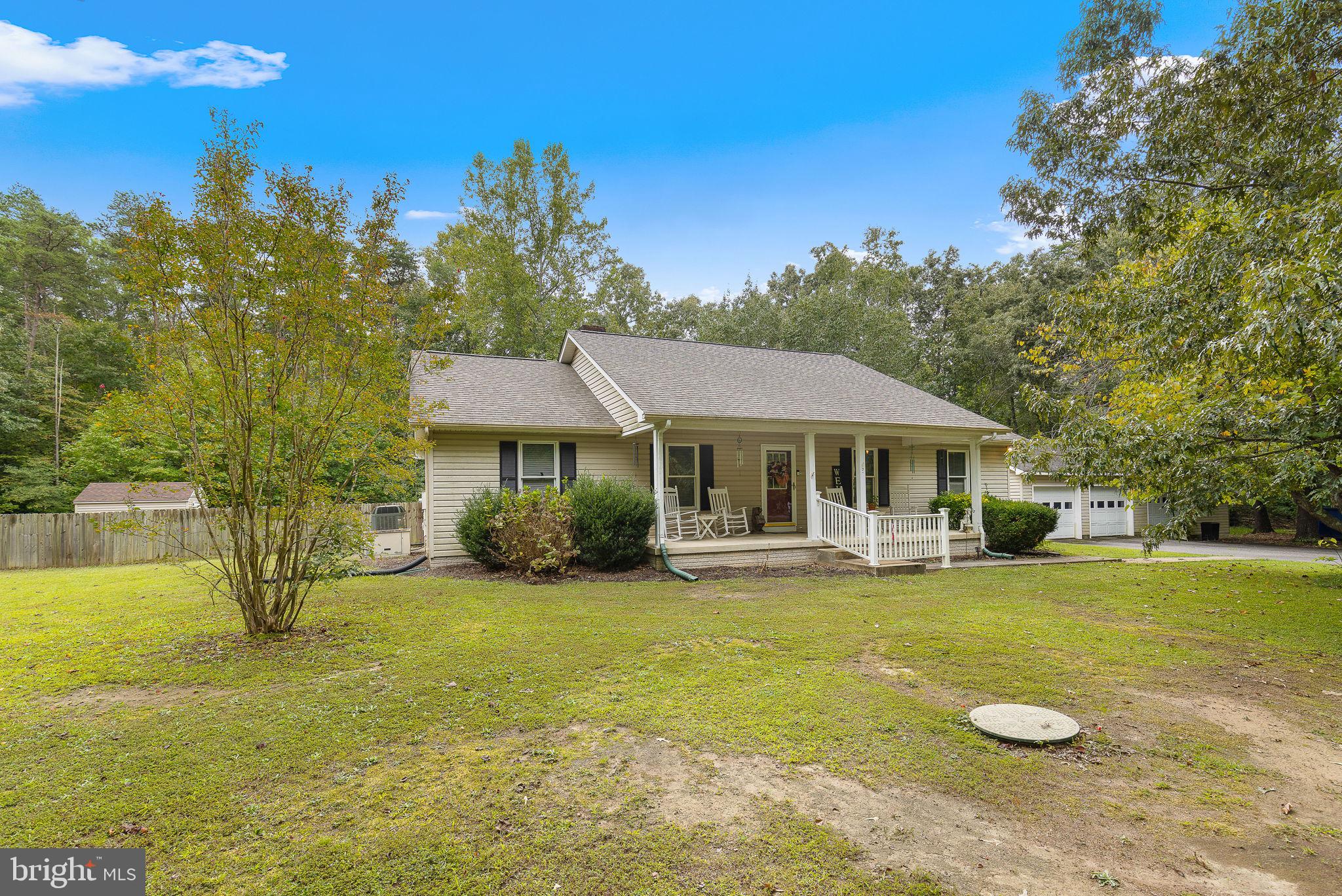 Welcome to 7201 Millstream Drive, a lovely two-story home with over 3000 square feet on 3+acres!  This home has features for the ENTIRE family! The fully fenced backyard hosts an inground fiberglass pool (3'-6' depth) with salt-water system installed in 2017, paver patio, fire pit with sitting wall, deck, covered patio, storage shed, & a large fenced dog pen.  Huge three car detached garage has electric, workspace, parking spaces, storage area, a chimney flu, generator hook up, & a lean-to outside for equipment storage. The covered front porch is wide with a serene country view.  The main level has real hardwood flooring throughout, three large bedrooms, & two full bathrooms. The primary bathroom includes a washer & dryer! The oversized living room is suitable to fit any furniture you bring! The kitchen has newer appliances, gas cooking, pantry, breakfast area, & walks out to deck.
The lower level includes a wet bar/mini kitchen, full bathroom, a den with closet, expansive open space for recreation, & an entrance door to the backyard. There is a large unfinished area with a washer & dryer hook up, utility access, & space to create a home gym or office! 
This home is well loved, great for entertainment, potential in-law suite, ample space to bring your hobbies or business, & more.