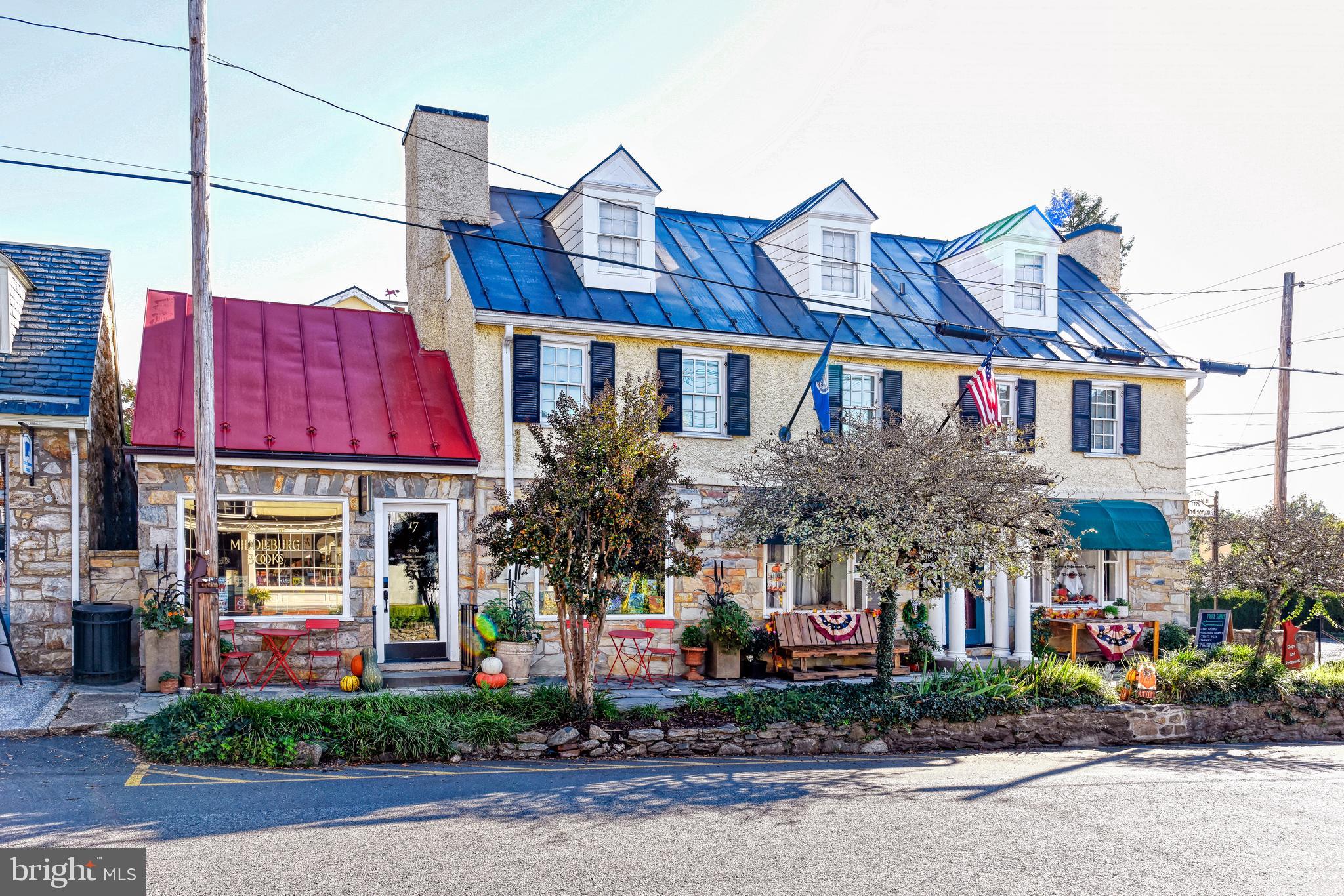 Wonderful commercial opportunity to purchase a mixed use building fully rented in downtown historic Middleburg.  This unique building anchors the corner of Madison and Federal Streets just one block south of the stoplight in the middle of town. Great investment property that offers two wonderful commercial store fronts facing Madison Street and 4 residential rental units accessed off Federal Street. Comes with 3 private parking spaces. The main building fronting Madison Street was said to be housing for the carriage drivers when they came through the town. The building has loads of charm with a stone and stucco front, large picture windows ideal for displays, dormered upper windows, and standing seam metal roof. Walk around the corner to find brick sidewalks that lead to three separate entrances to four 1-2 bedroom upper level and lower level apartments. Ideal location for walking to restaurants, groceries, post office and more.  See documents for C-2 Zoning and History District information in the Documents section. Need at least 24-hour notice to show.