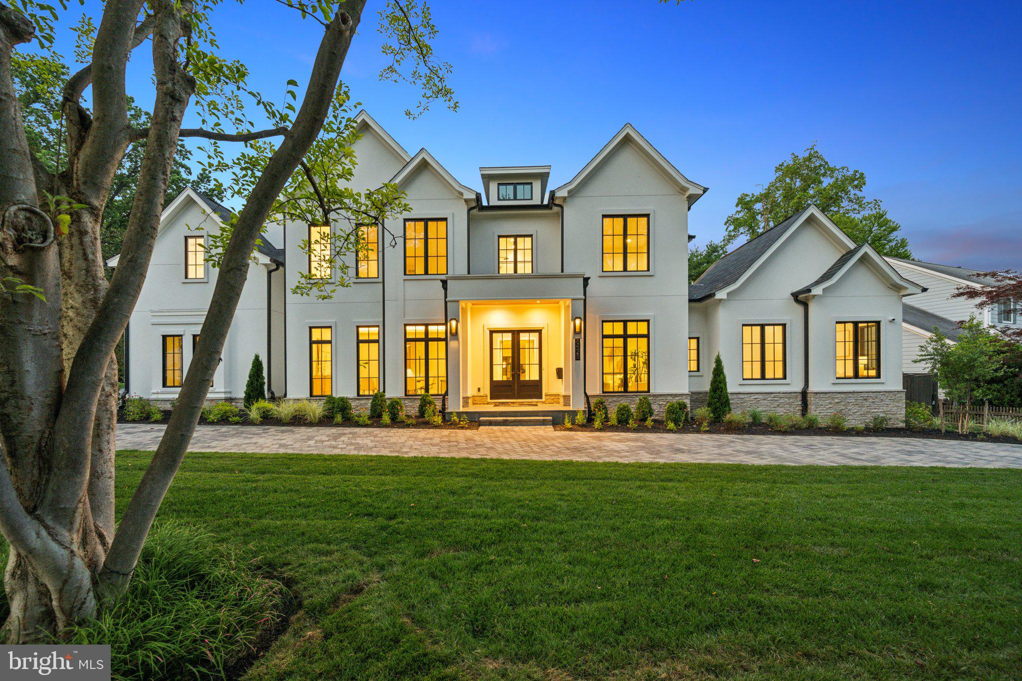 Welcome to 5425 Moorland Lane, an exquisite, newly constructed residence by Mid-Atlantic Custom Builders. Nestled on a private 0.53-acre lot in the prestigious Edgemoor neighborhood of Bethesda, this stunning home lies within the sought-after Walt Whitman High School cluster, showcasing the pinnacle of modern sophistication and elegant living.

Spanning approximately 8,670 square feet across three meticulously designed levels, this masterpiece offers an unparalleled living experience. The residence features six spacious bedroom suites, each with its own en-suite bath, a total of eight full baths, and two half baths.

Upon arrival, the striking stucco exterior, crafted with an impeccable blend of natural stone and contemporary design elements, is graciously framed by a circular paver driveway, setting the tone for the grandeur within.

The open-concept main level is perfect for both everyday living and entertaining. Featuring a formal living room, dining room, great room, and breakfast room, each space is perfectly proportioned and thoughtfully designed. At the heart of the home, a gourmet kitchen, a chef’s dream, is equipped with top-of-the-line appliances, the highest quality custom cabinetry, and a large center island adorned with striking quartzite countertops. A well-thought-out and stunning butler's pantry is equipped with a Sub-Zero wine tower, warming drawer, and ample additional storage, combining design and functionality for catered events. The screened-in porch off the great room features vaulted ceilings, skylights, and a gas fireplace. Alongside the adjacent open outdoor dining area, they offer a seamless transition to the beautifully landscaped backyard, ideal for alfresco dining. For setting the perfect ambiance, the home is equipped with built-in ceiling-speakers in almost all common areas and primary suite. 

Also on the main level is a private guest suite. Spacious and luxurious, this light-filled suite features vaulted ceilings, a full bathroom, and a walk-in closet, making it versatile as a home office.

The mudroom off the three-car garage is designed with custom cabinets and cubbies, a large walk-in closet, and a full bathroom, with additional access to the backyard—perfect for when an outdoor pool is added.

The upper level is a sanctuary of comfort, with the luxurious primary suite as its centerpiece. This serene space includes a generously sized room with vaulted ceilings and beautiful beams, and a spa-like en-suite bathroom complete with heated floors, a soaking tub, dual vanities, and a glass-enclosed rain and steam shower. Also on the upper level is a fantastic family lounge, accessible directly from the back staircase—perfect for a study or hangout area. Three additional bedroom suites, each with ample closet space and en-suite bathrooms, ensure every resident enjoys their own private oasis. Additionally, a great laundry room with ample storage completes this level.

The lower level is designed for entertainment and leisure, centered around a spacious rec room, state-of-the-art home theater, a luxury bar, a powder room, an oversized fitness room with a private full bathroom, and a guest suite with another full bathroom.

The private, fenced backyard is ready for your imagination. Whether envisioning a pool and pool house, lavish gardens, or both, with so much space, the sky is the limit!

Experience the height of luxury living in this magnificent Edgemoor residence, where exceptional construction quality and outstanding finishes come together to create a truly remarkable home.
